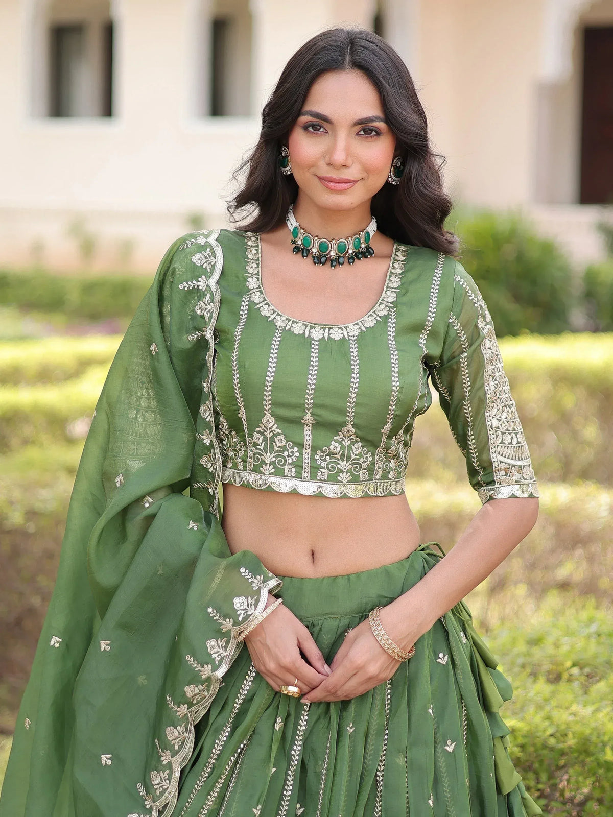 Green embroidered lehenga choli with gold detailing, perfect for Indian ethnic wear occasions