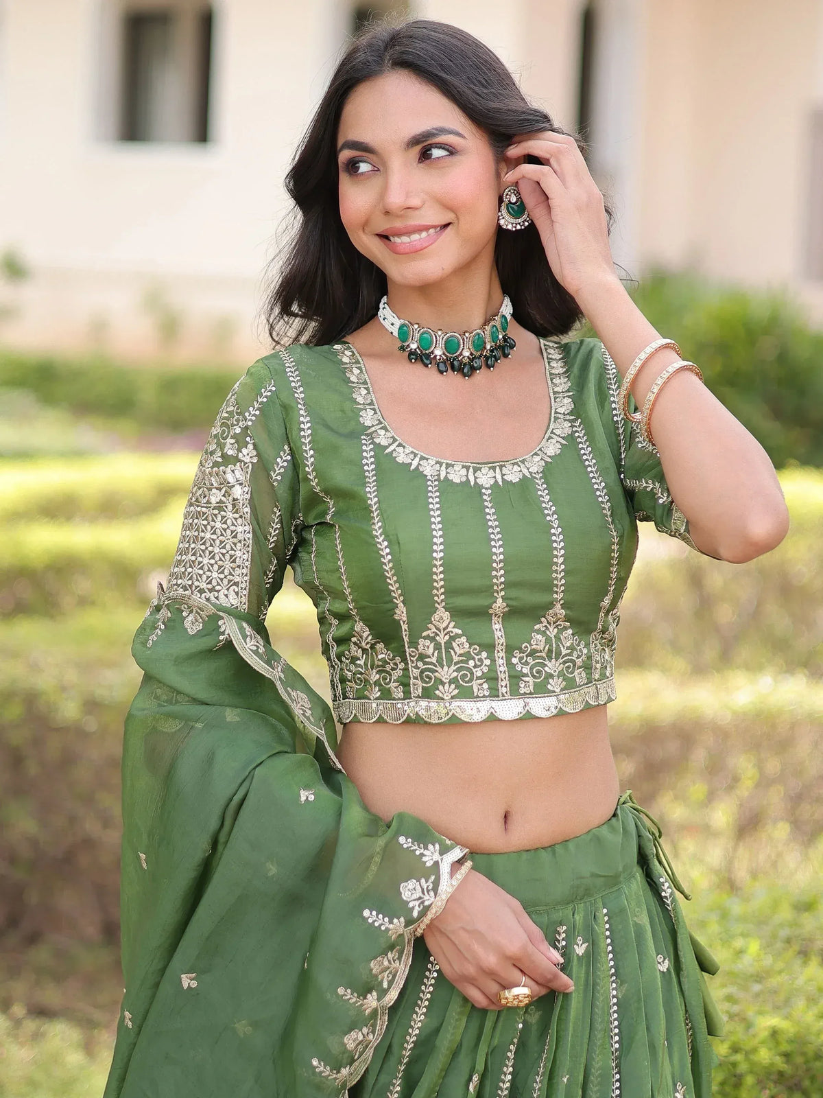 Green embroidered lehenga choli with gold detailing, perfect for Indian ethnic wear and festive occasions.