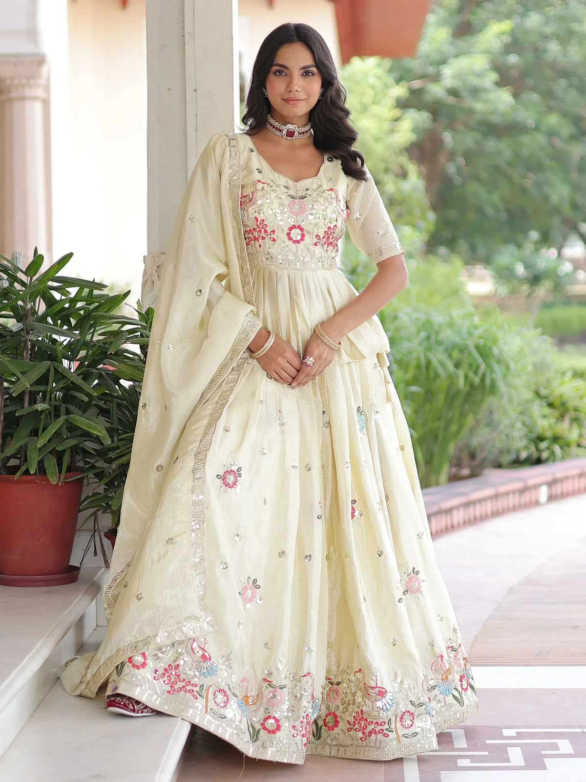 Elegant cream designer lehenga choli with floral embroidery and sequins for Indian ethnic wear