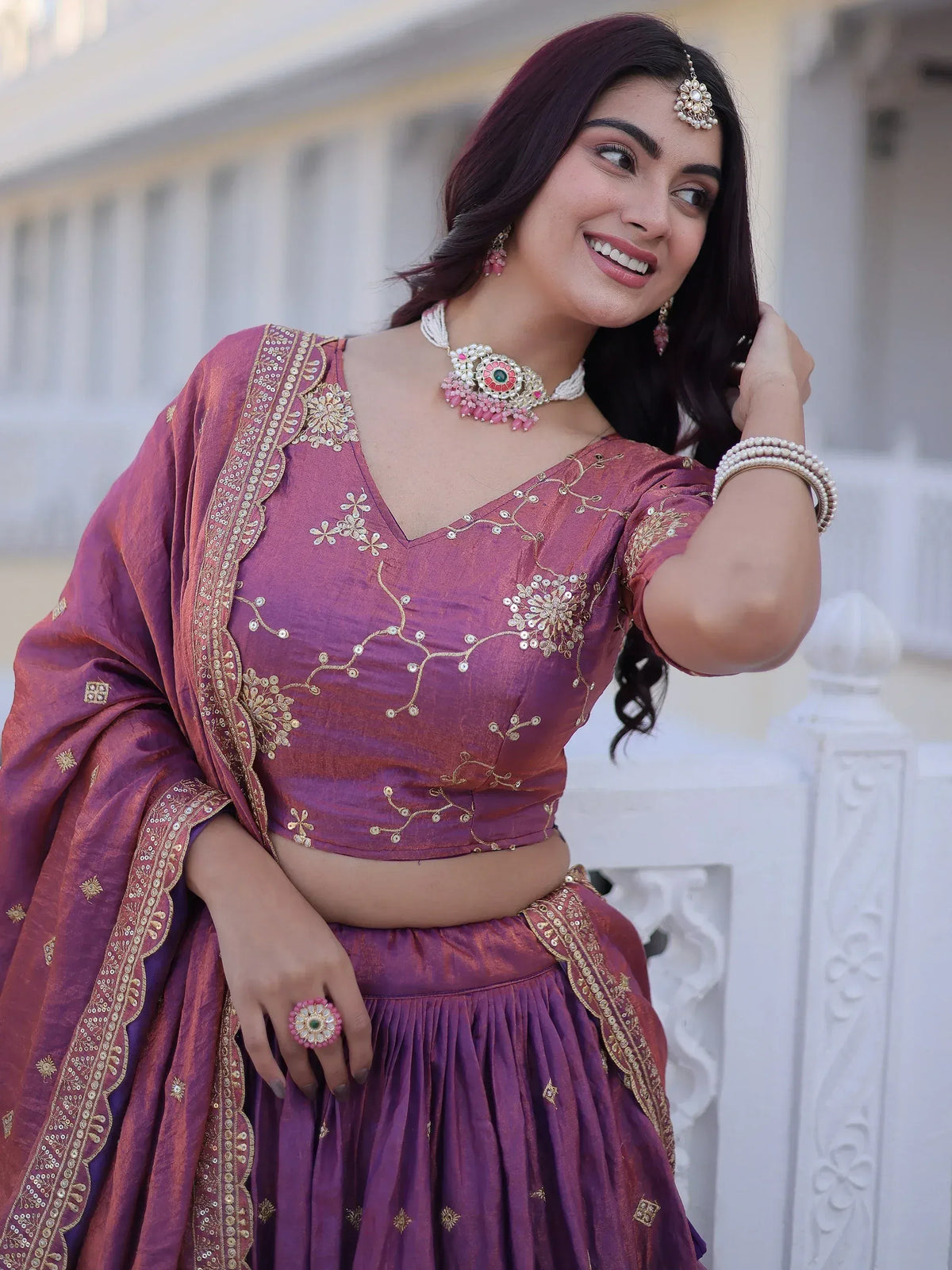 Purple embroidered lehenga choli with gold detailing, perfect for Indian ethnic wear and festive occasions.