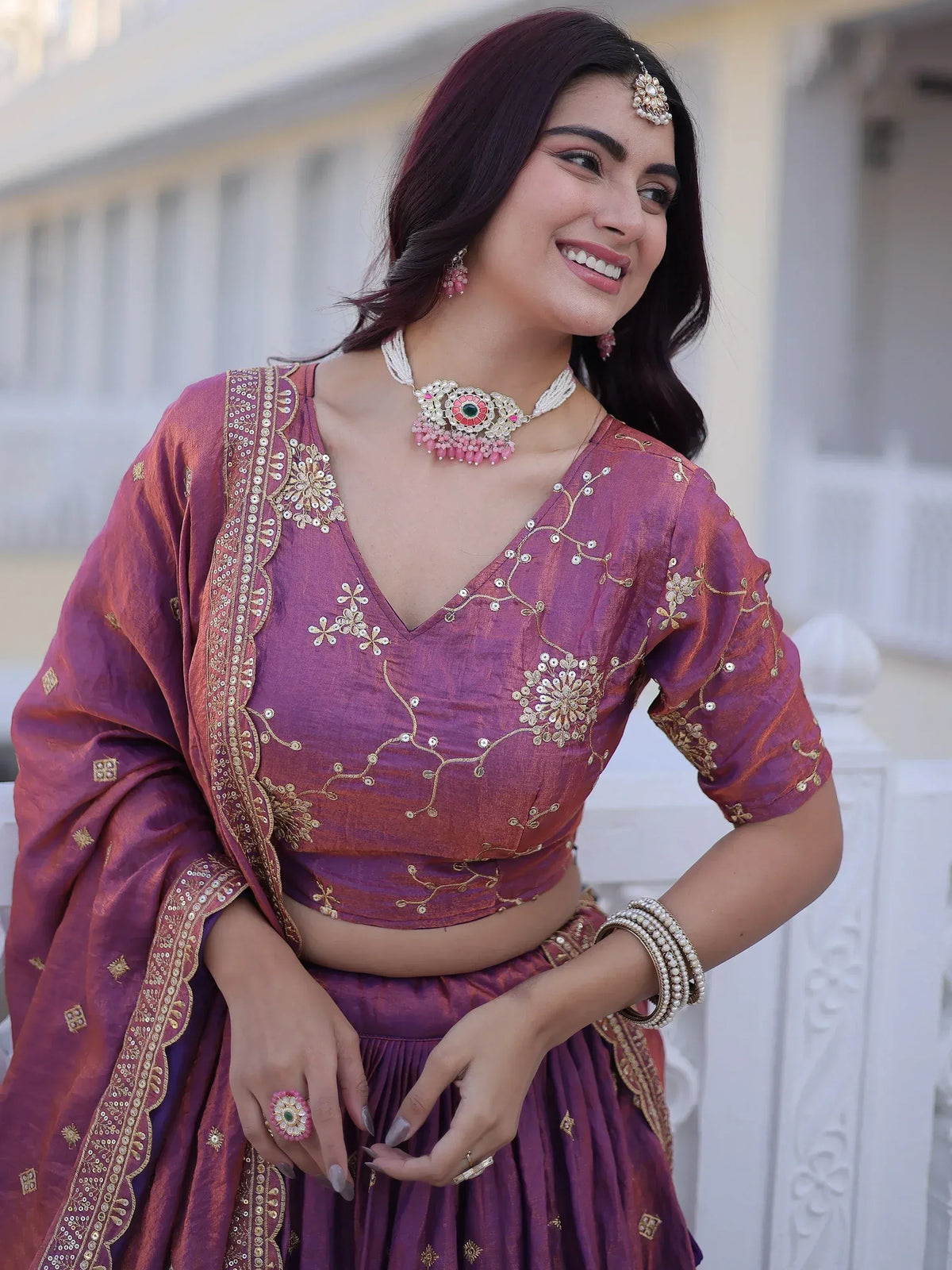Purple embroidered lehenga choli with gold detailing, perfect for Indian ethnic wear and festive occasions.