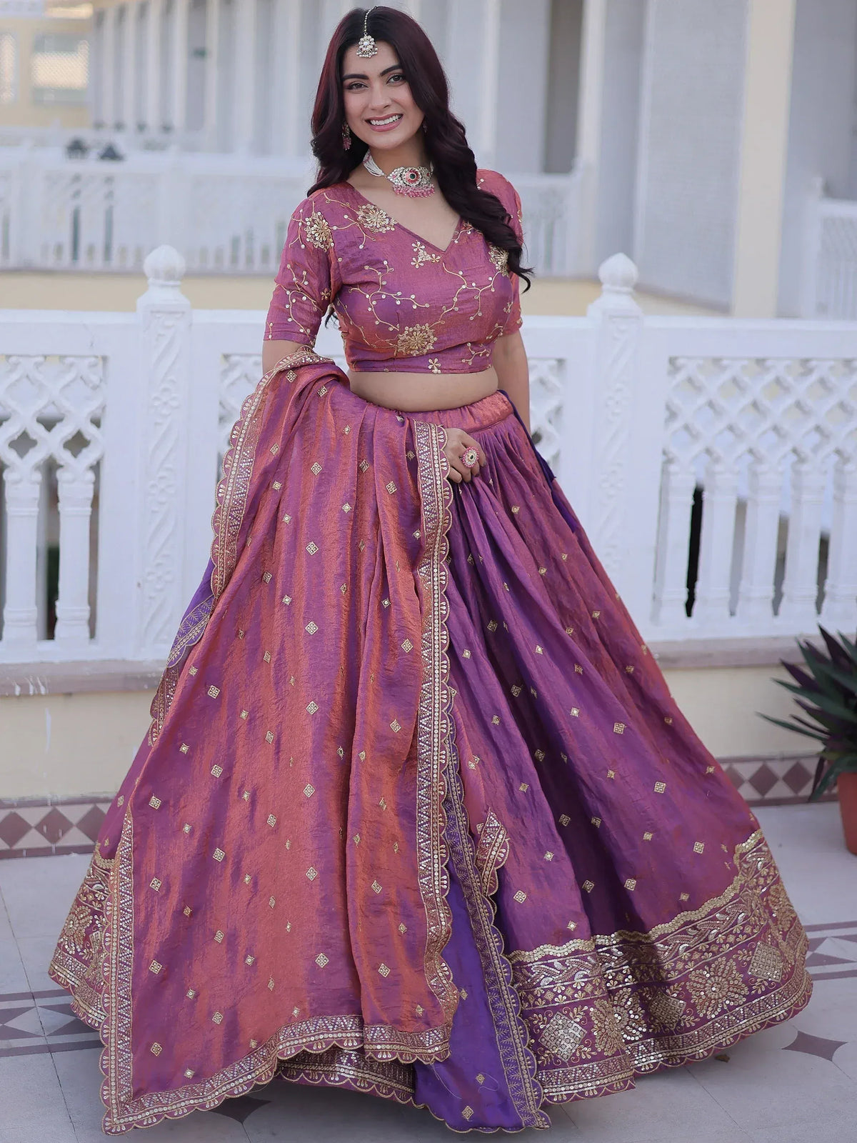Purple and gold embroidered lehenga choli with intricate detailing, perfect for Indian ethnic wear occasions.