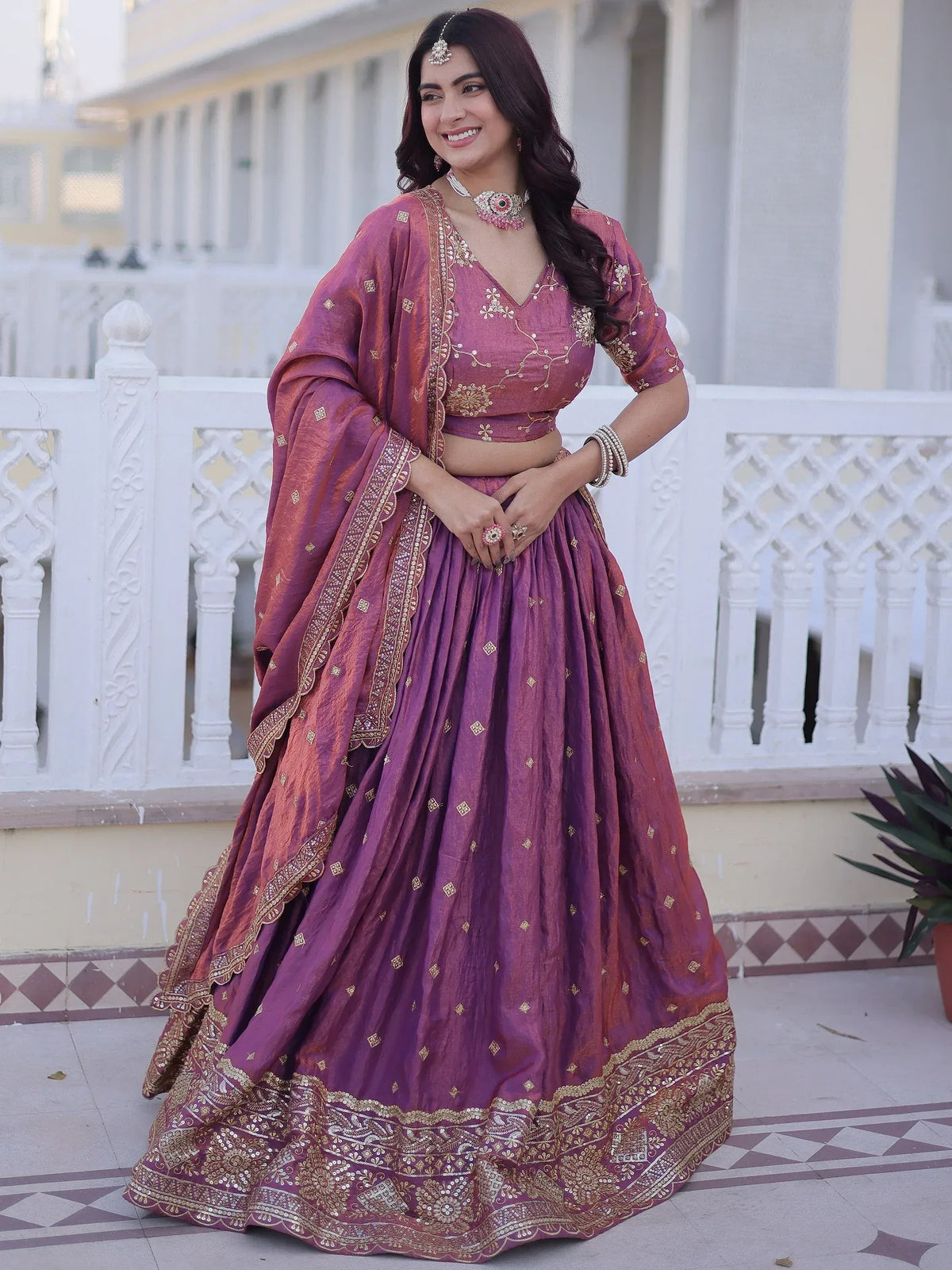 Purple designer lehenga choli with gold embroidery, perfect for Indian weddings and festive occasions