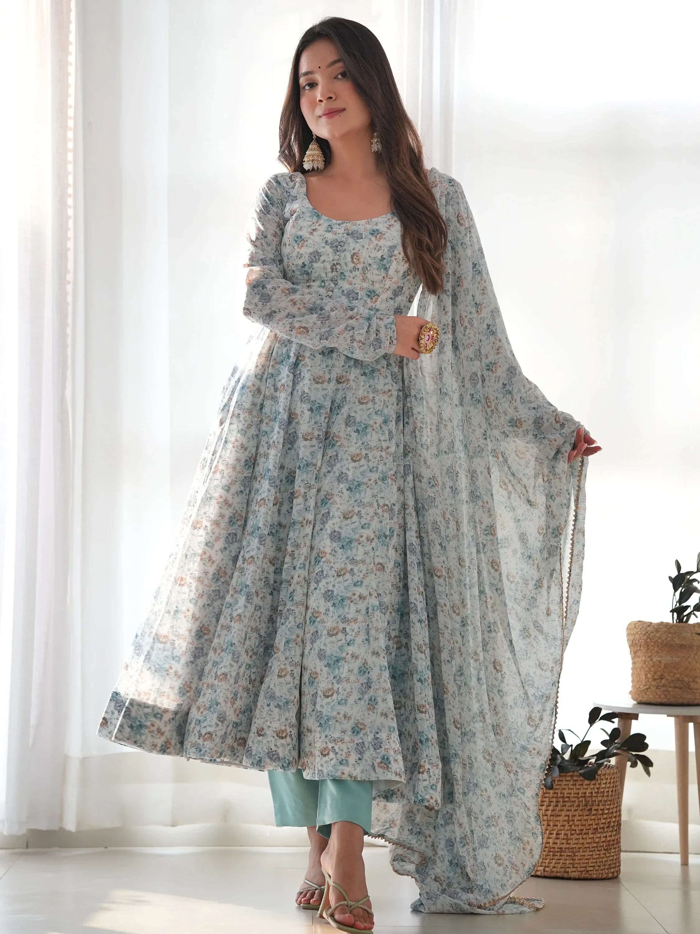 Woman wearing floral print Anarkali suit with dupatta, stylish Indian ethnic wear