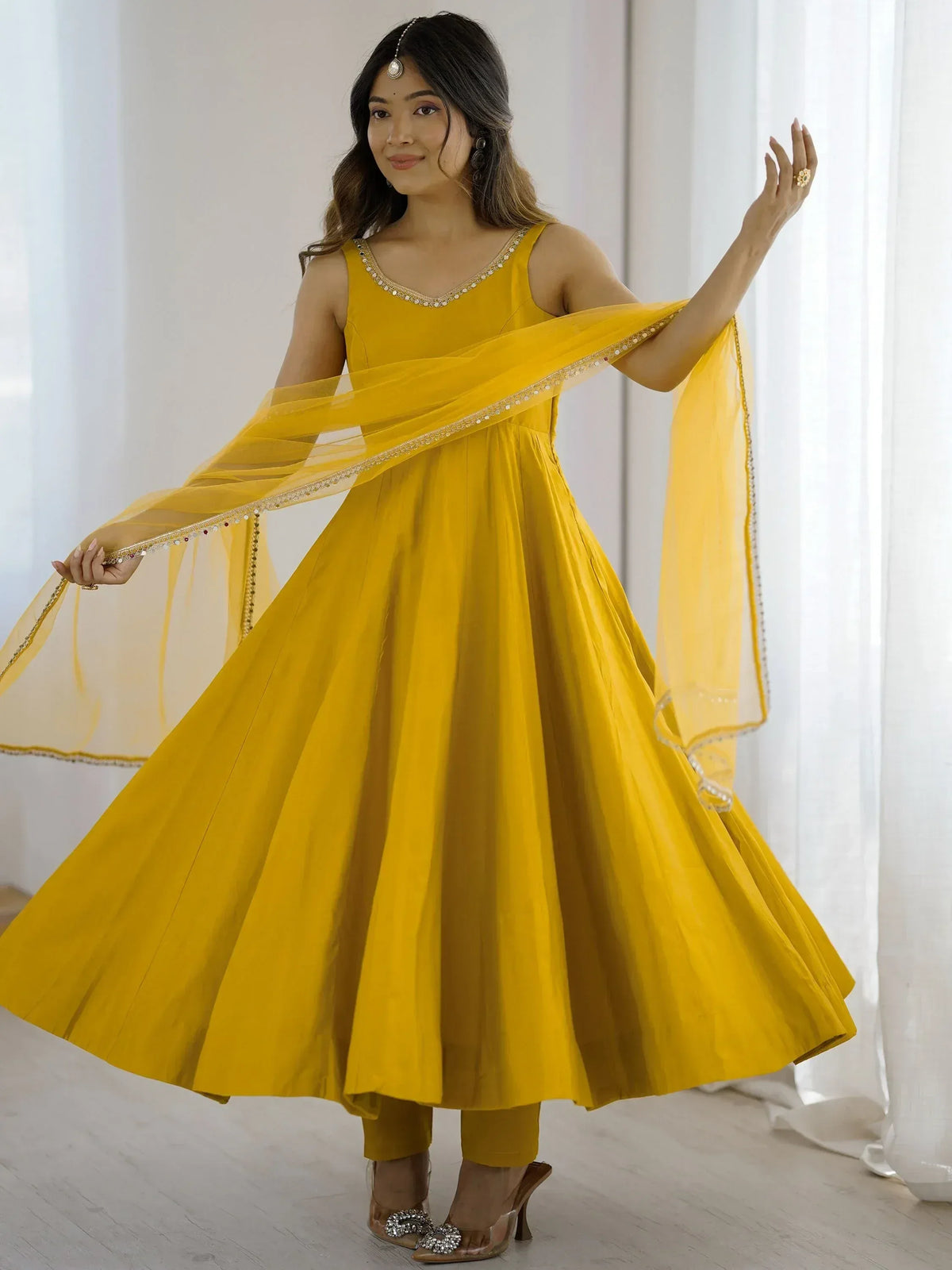 Yellow ethnic anarkali gown with dupatta, perfect for Indian weddings and festive occasions