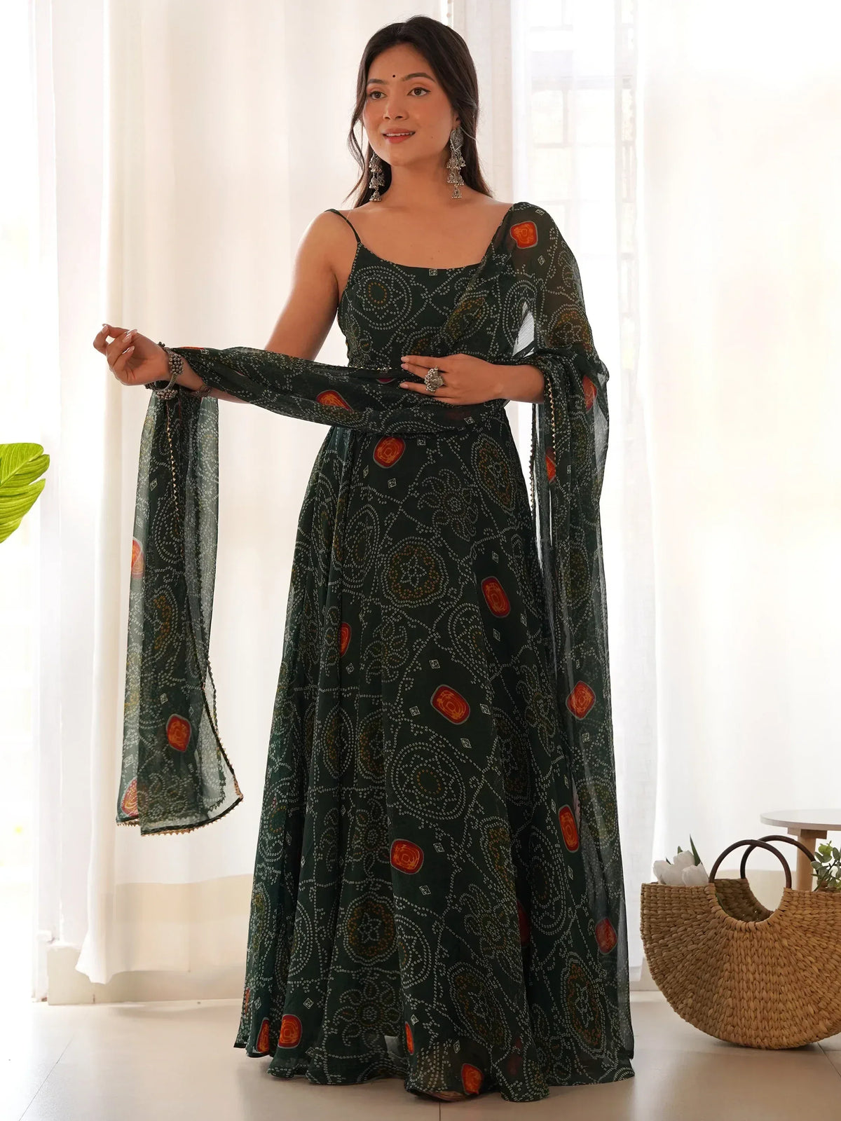 Green printed ethnic gown with flared sleeves, perfect for Indian occasions and festive wear.