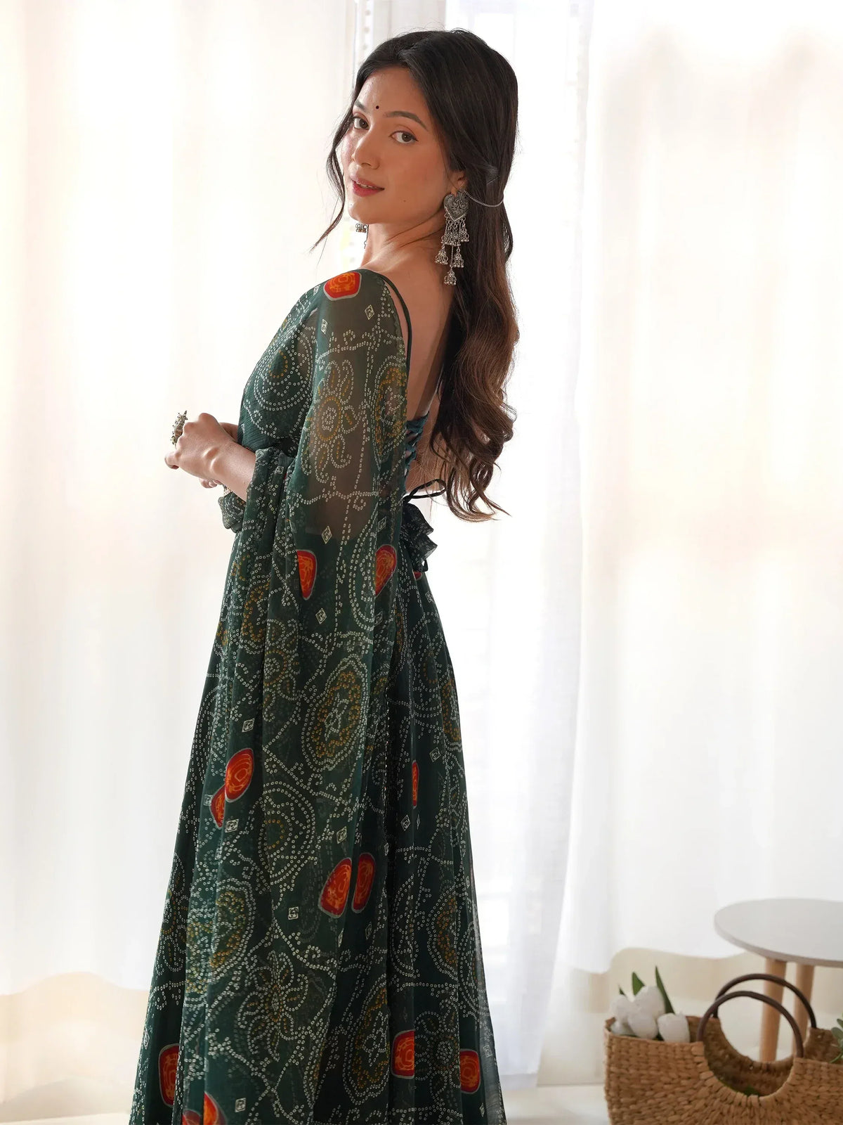Green printed ethnic gown with back tie design and floral patterns