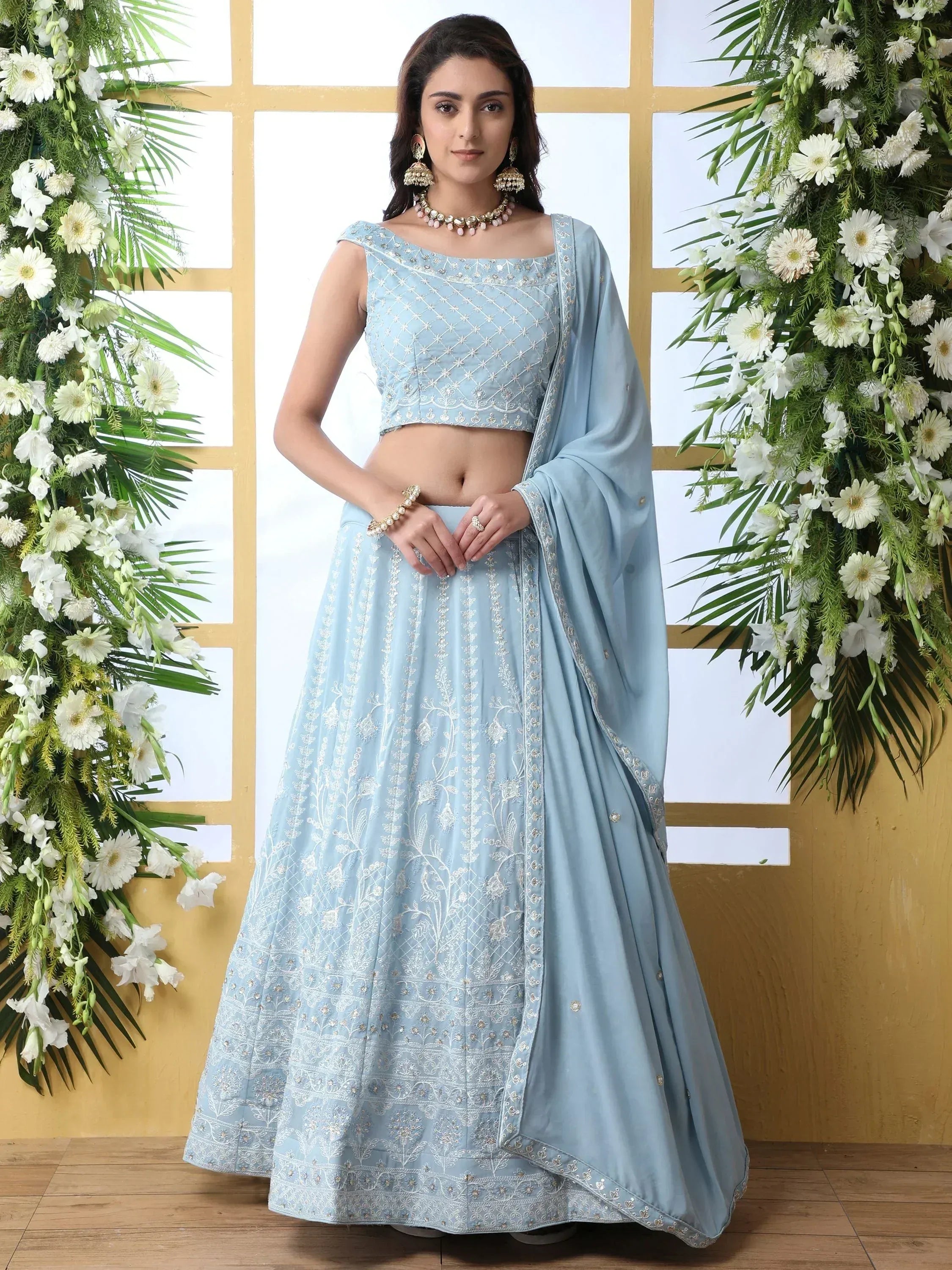 Light blue embroidered lehenga choli with floral motifs, perfect for Indian ethnic occasions
