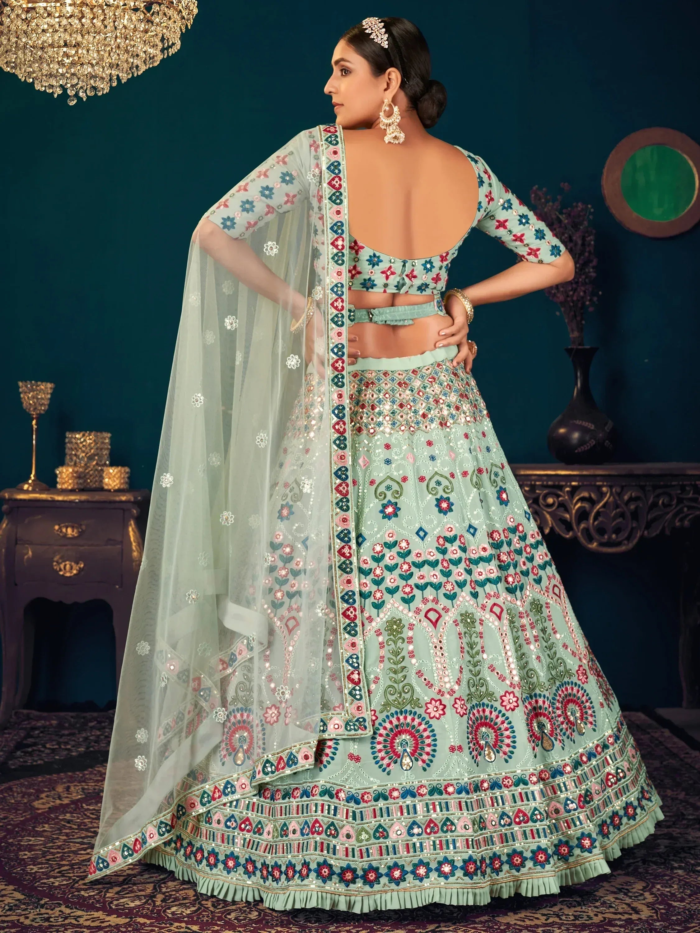Mint green embroidered lehenga choli with floral motifs and sheer dupatta, perfect for Indian ethnic wear occasions.