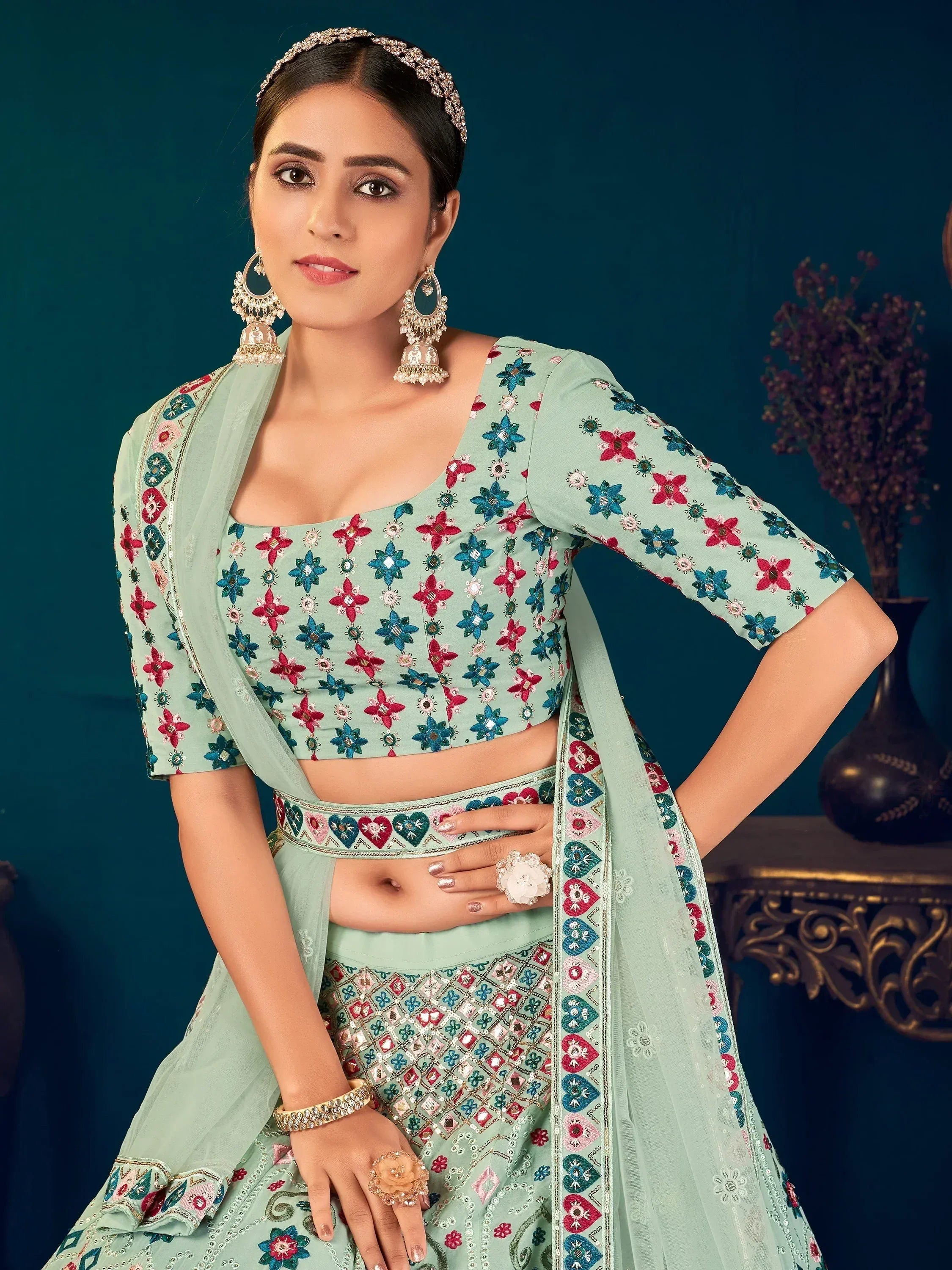 Mint green embroidered lehenga choli with floral motifs and matching dupatta, perfect for Indian ethnic occasions