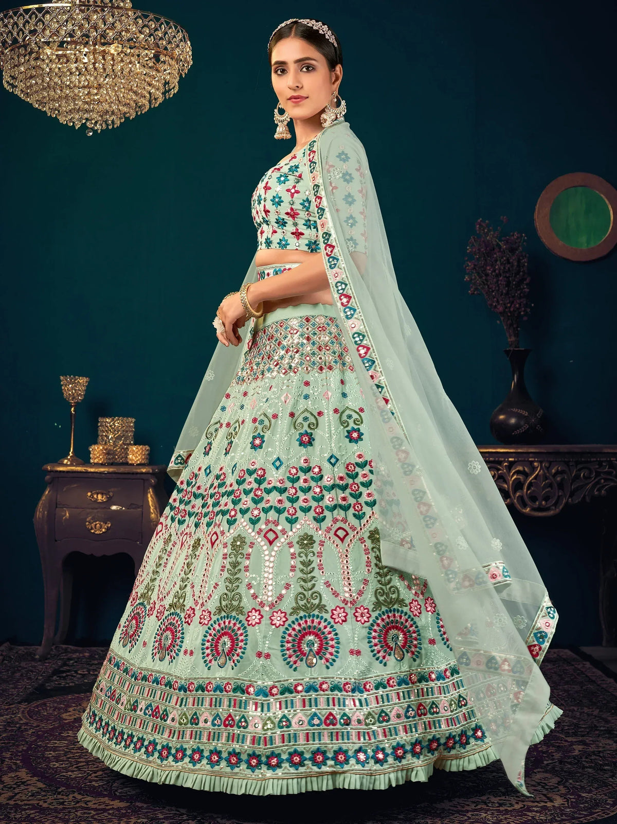 Mint green embroidered lehenga choli with floral motifs and dupatta, perfect for Indian ethnic wear occasions