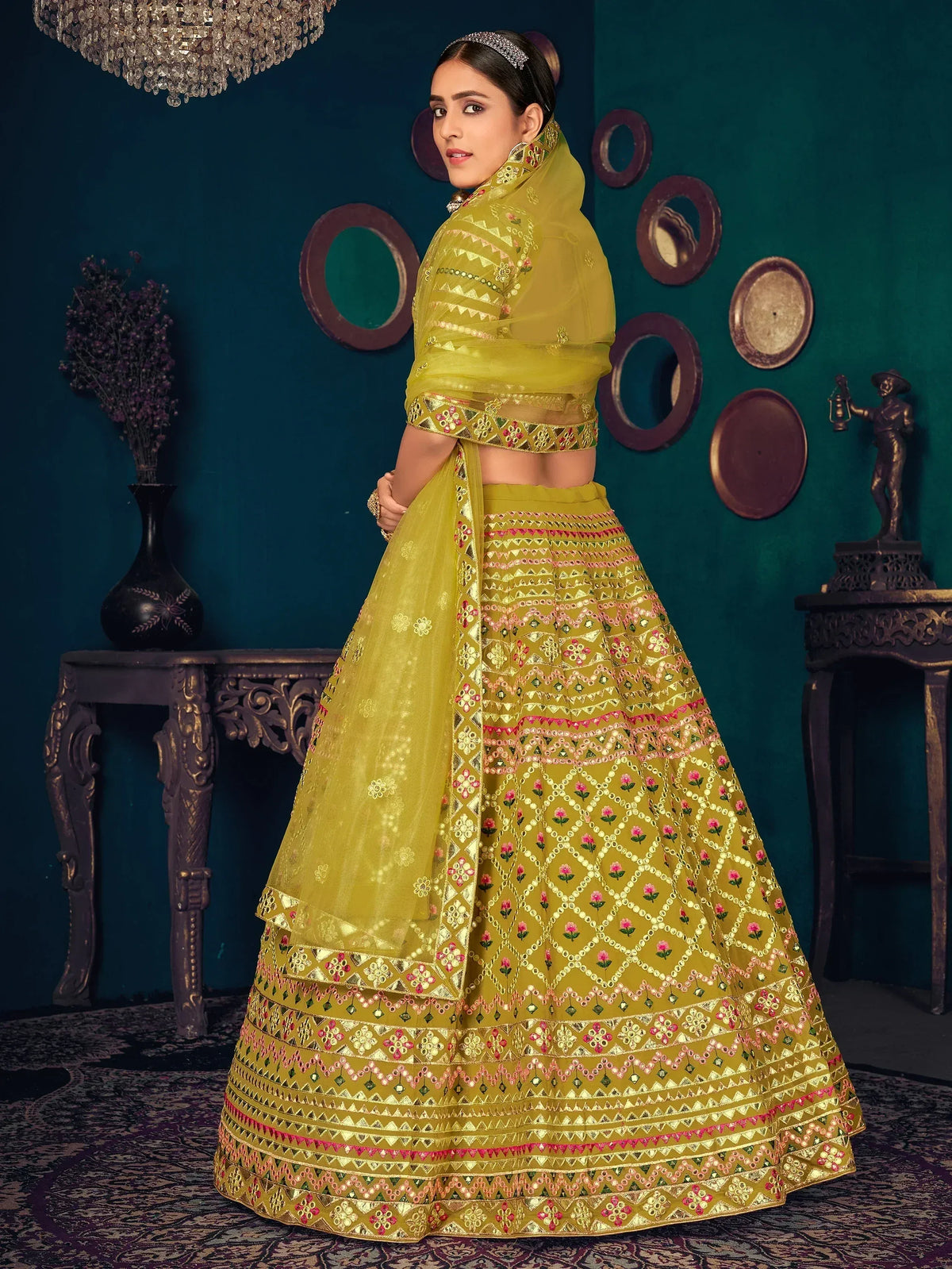Yellow embroidered lehenga choli with floral and geometric patterns, perfect for Indian ethnic wear occasions