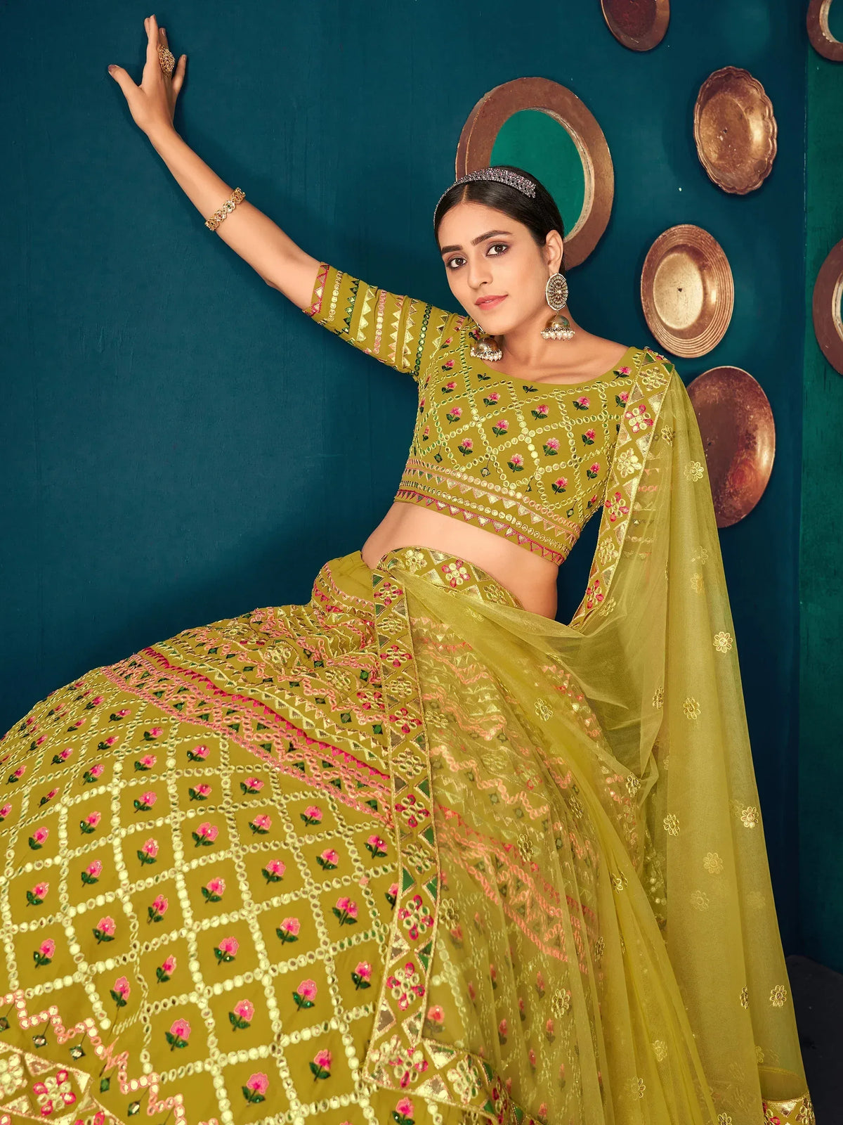 Olive green embroidered lehenga choli with floral motifs and sheer dupatta, perfect for Indian ethnic occasions.