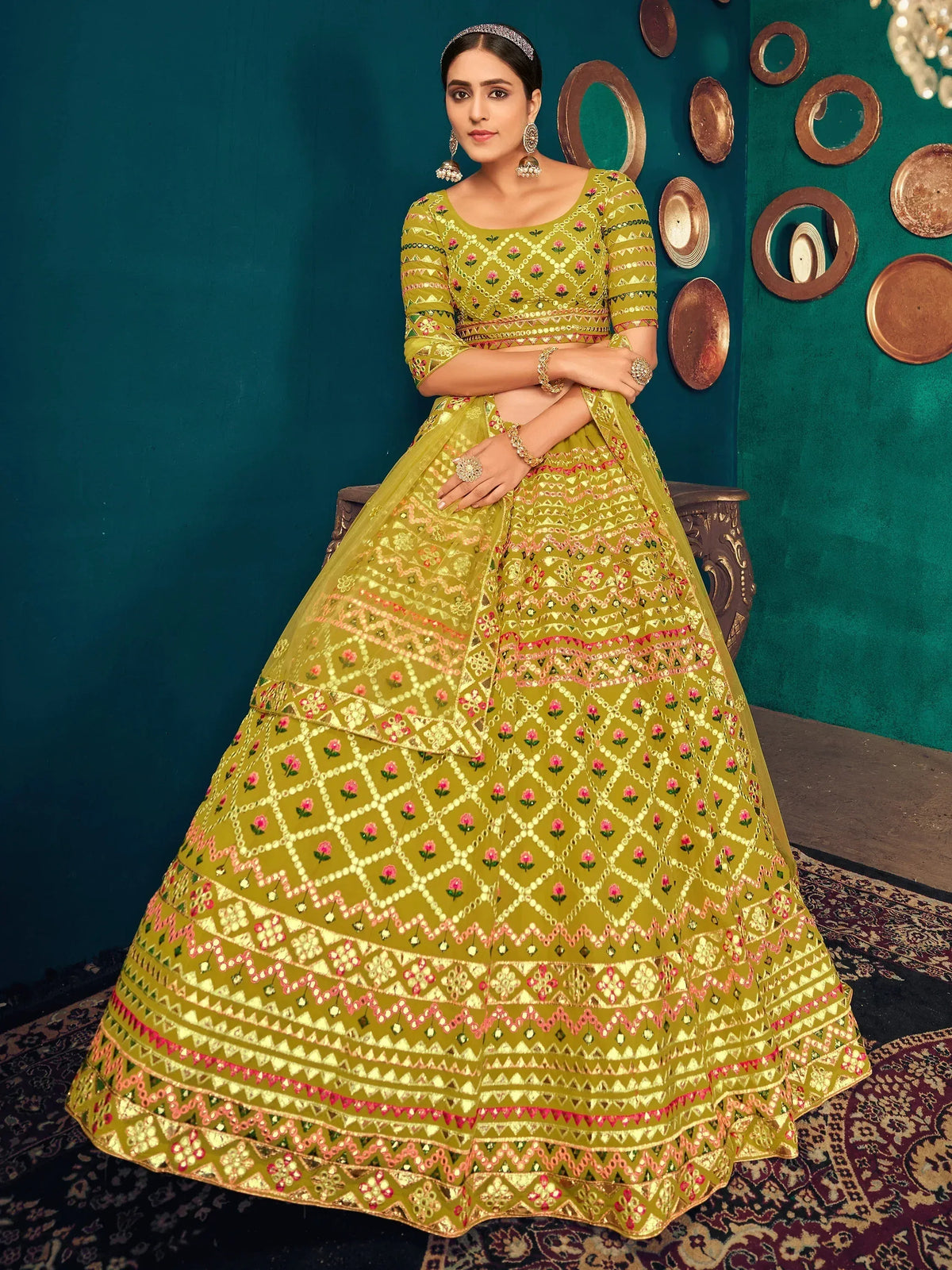 Olive green embroidered lehenga choli with floral and geometric patterns, perfect for Indian ethnic wear
