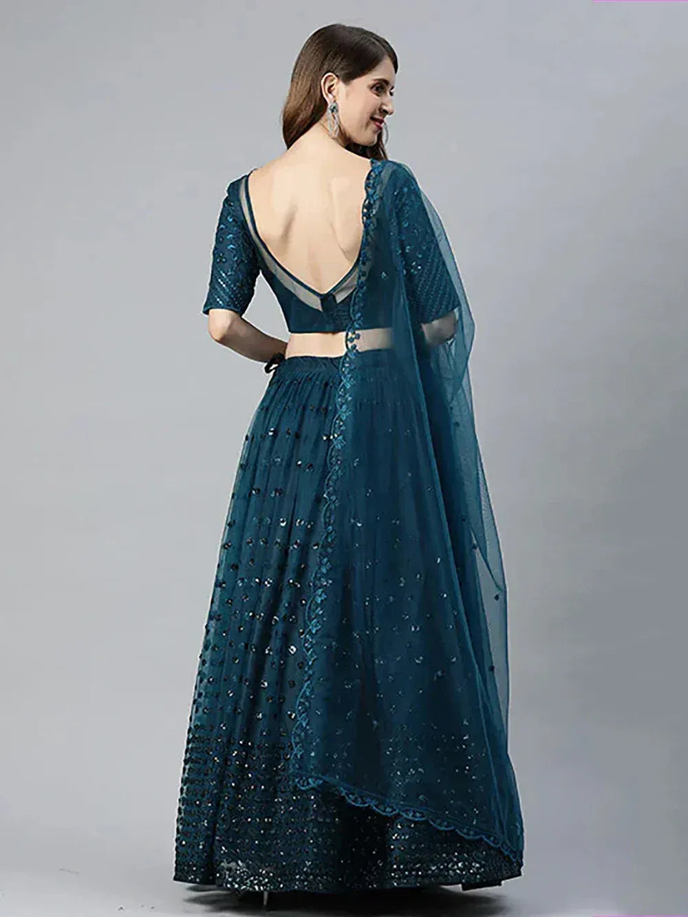 Teal blue embroidered lehenga choli with backless blouse and sheer dupatta, Indian ethnic wear