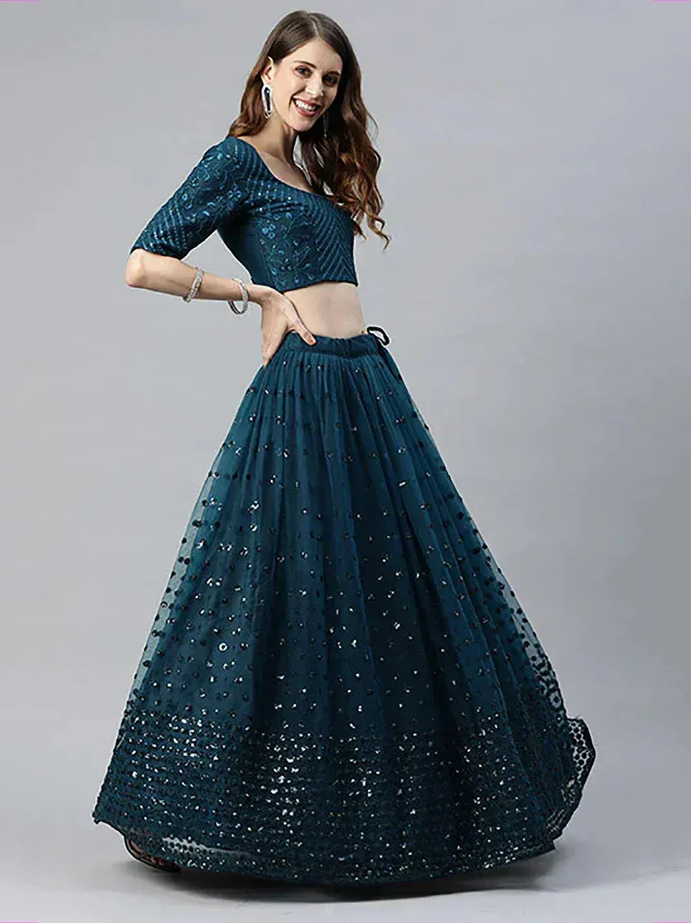 Teal sequin lehenga choli with flared skirt and crop top, Indian ethnic wear for weddings and parties