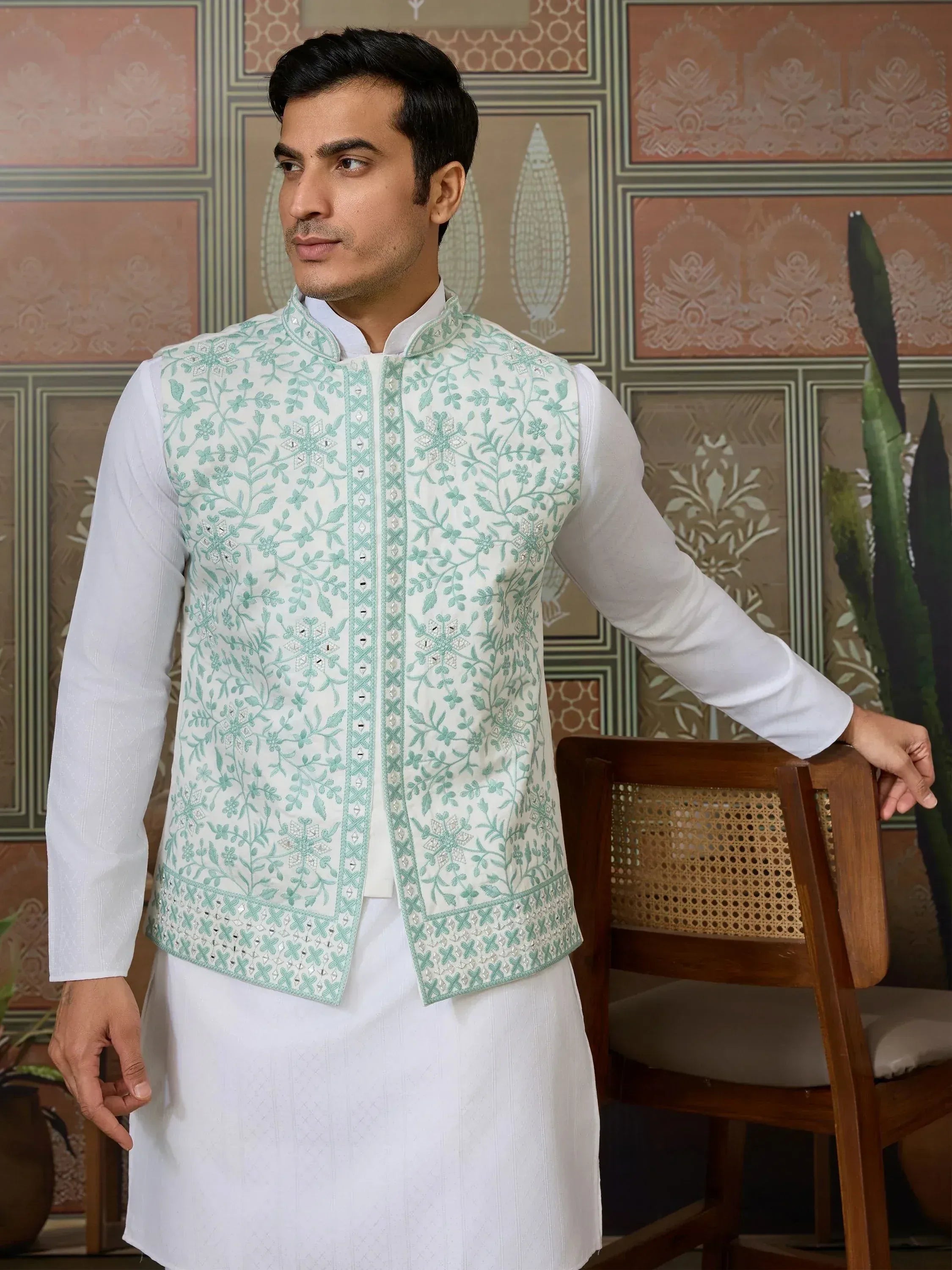 Men's ethnic wear: white kurta with mint green embroidered Nehru jacket for weddings or festivals