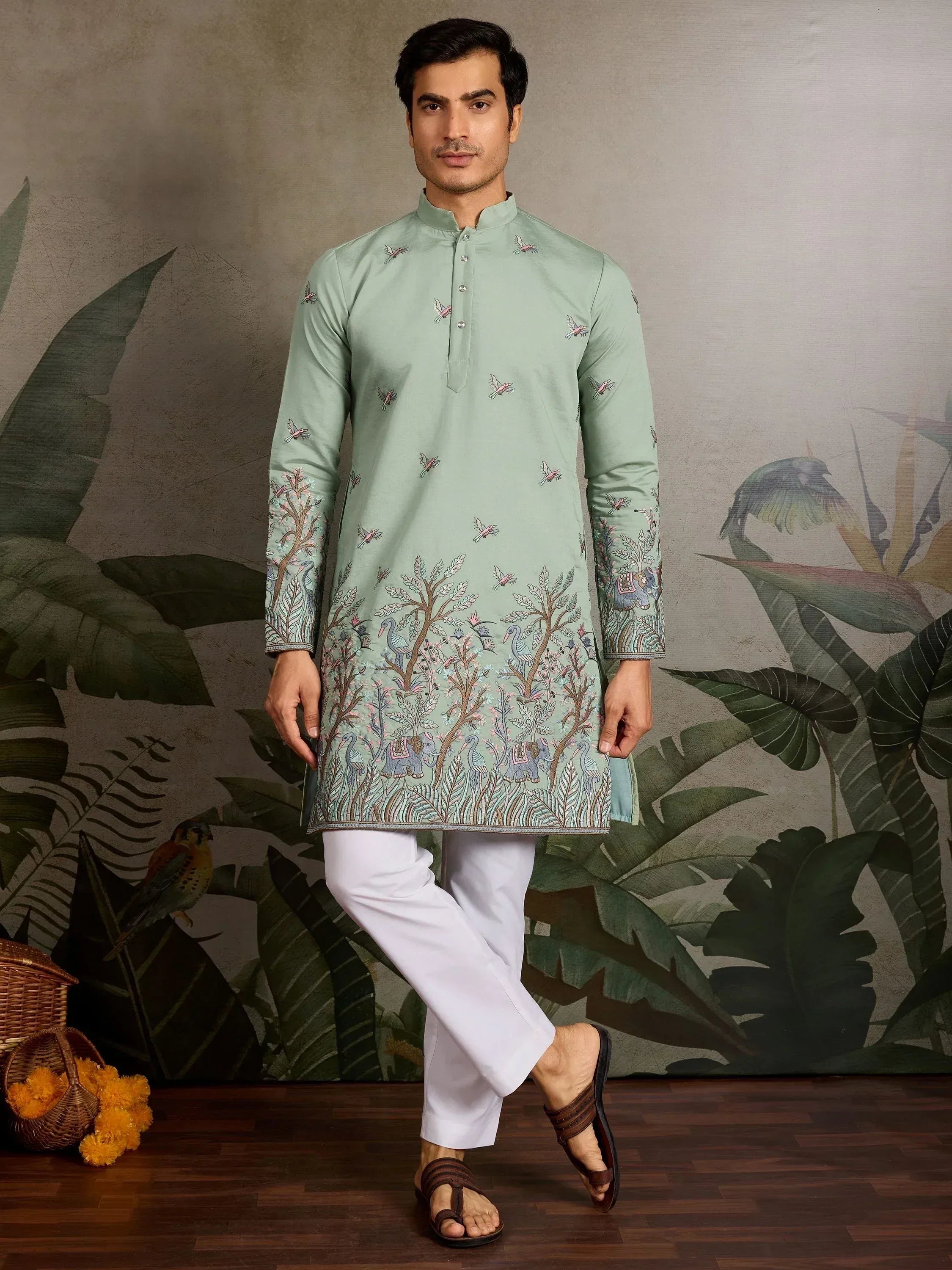 Mint green embroidered kurta with bird and elephant motifs, paired with white pants for men's ethnic wear