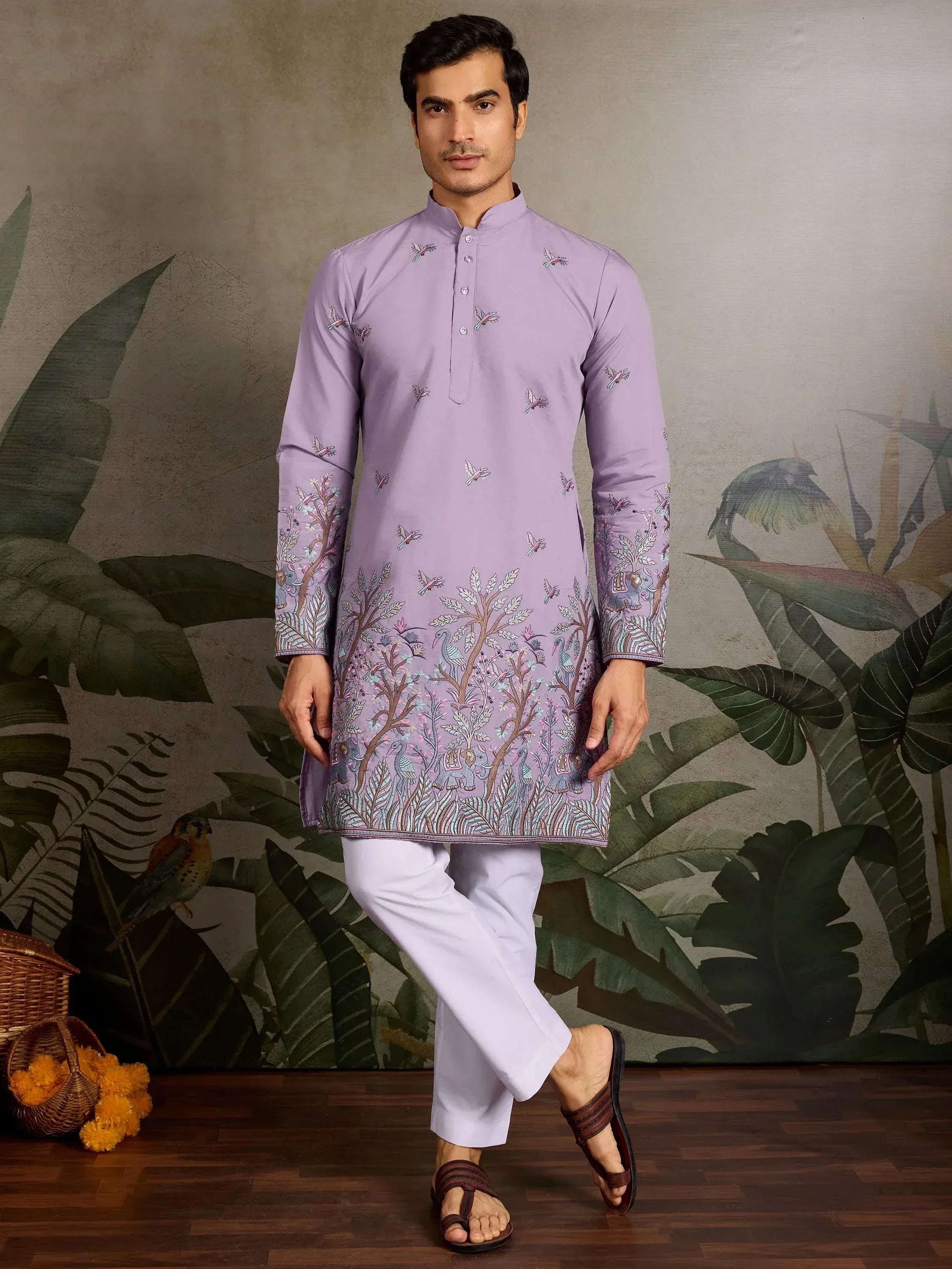 Men's lavender kurta with bird and tree embroidery, paired with white pants for ethnic wear