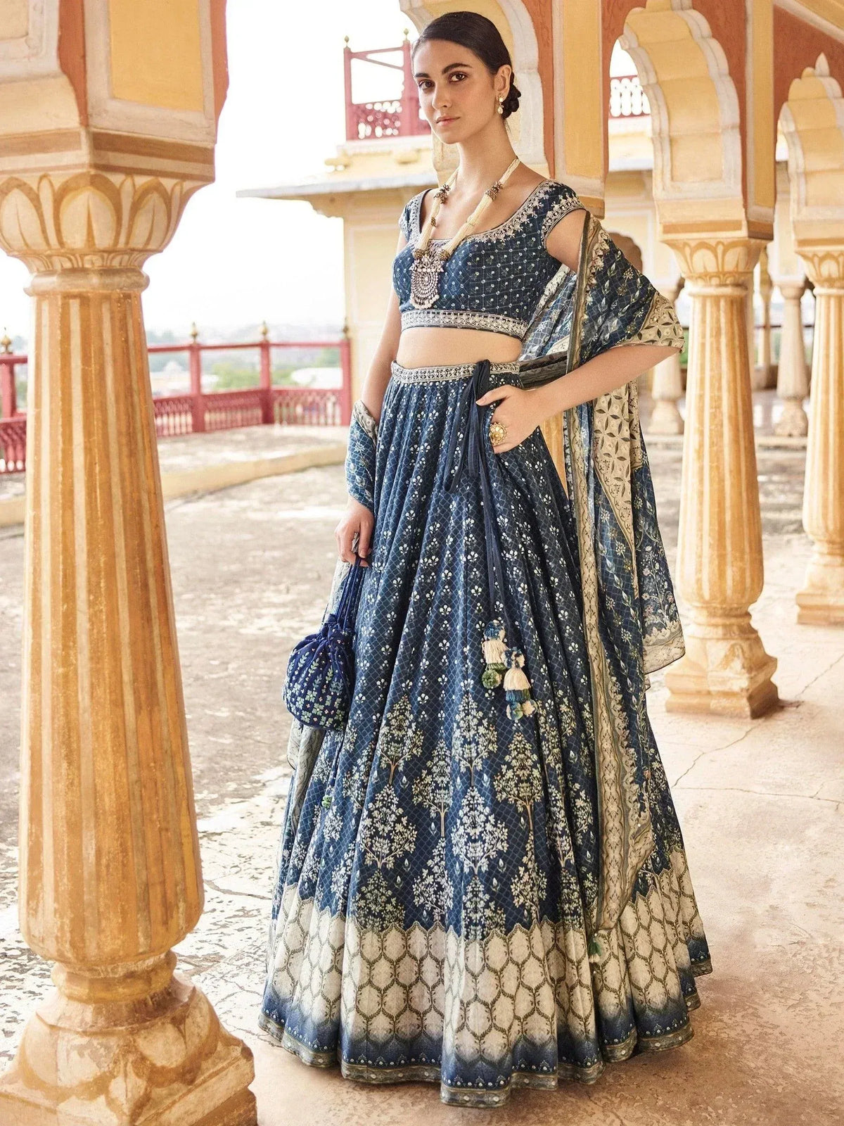 Blue printed lehenga choli with floral motifs, perfect for Indian ethnic wear and festive occasions.