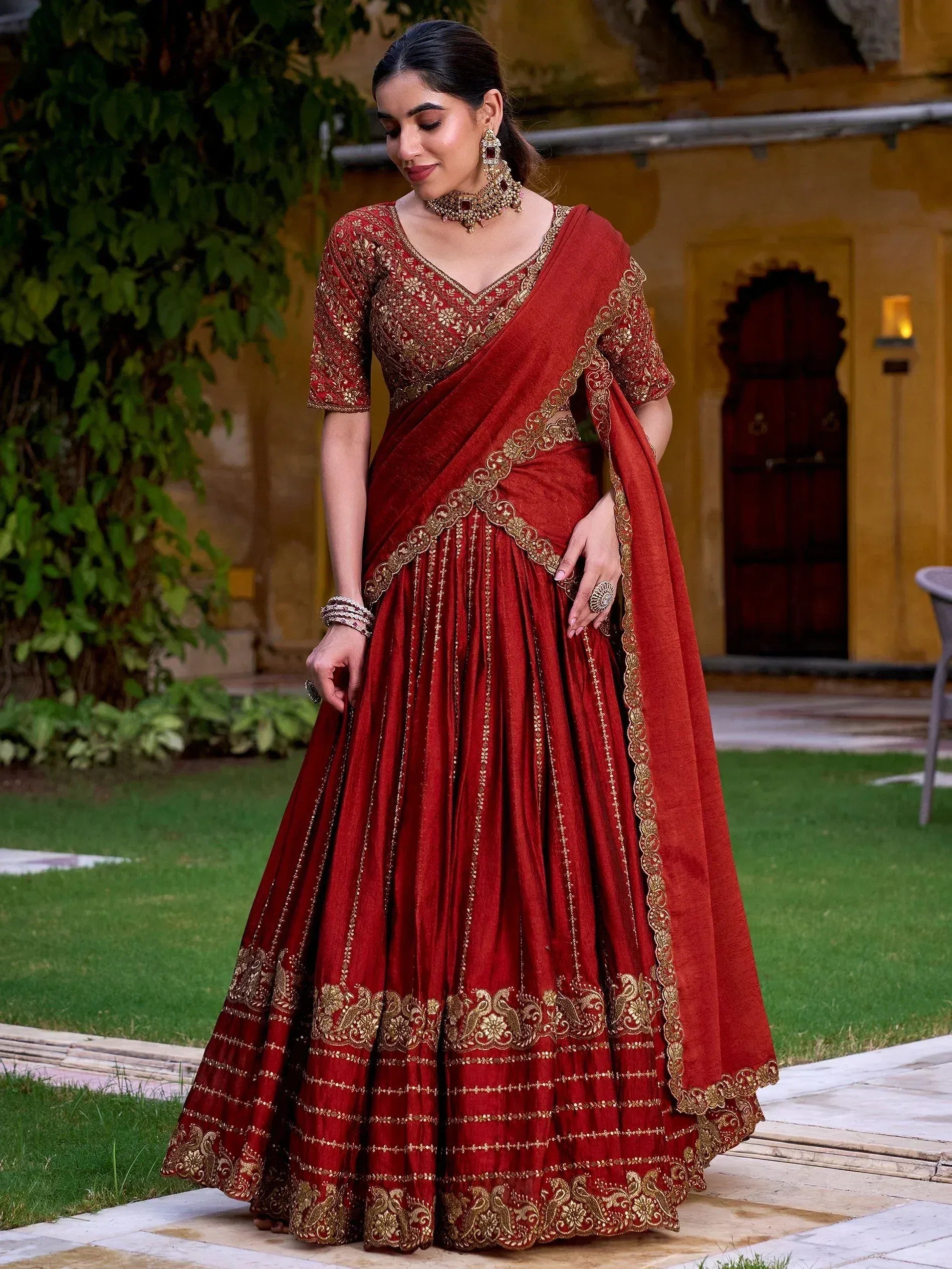 Red designer lehenga choli with gold embroidery, perfect for Indian ethnic wear and festive occasions