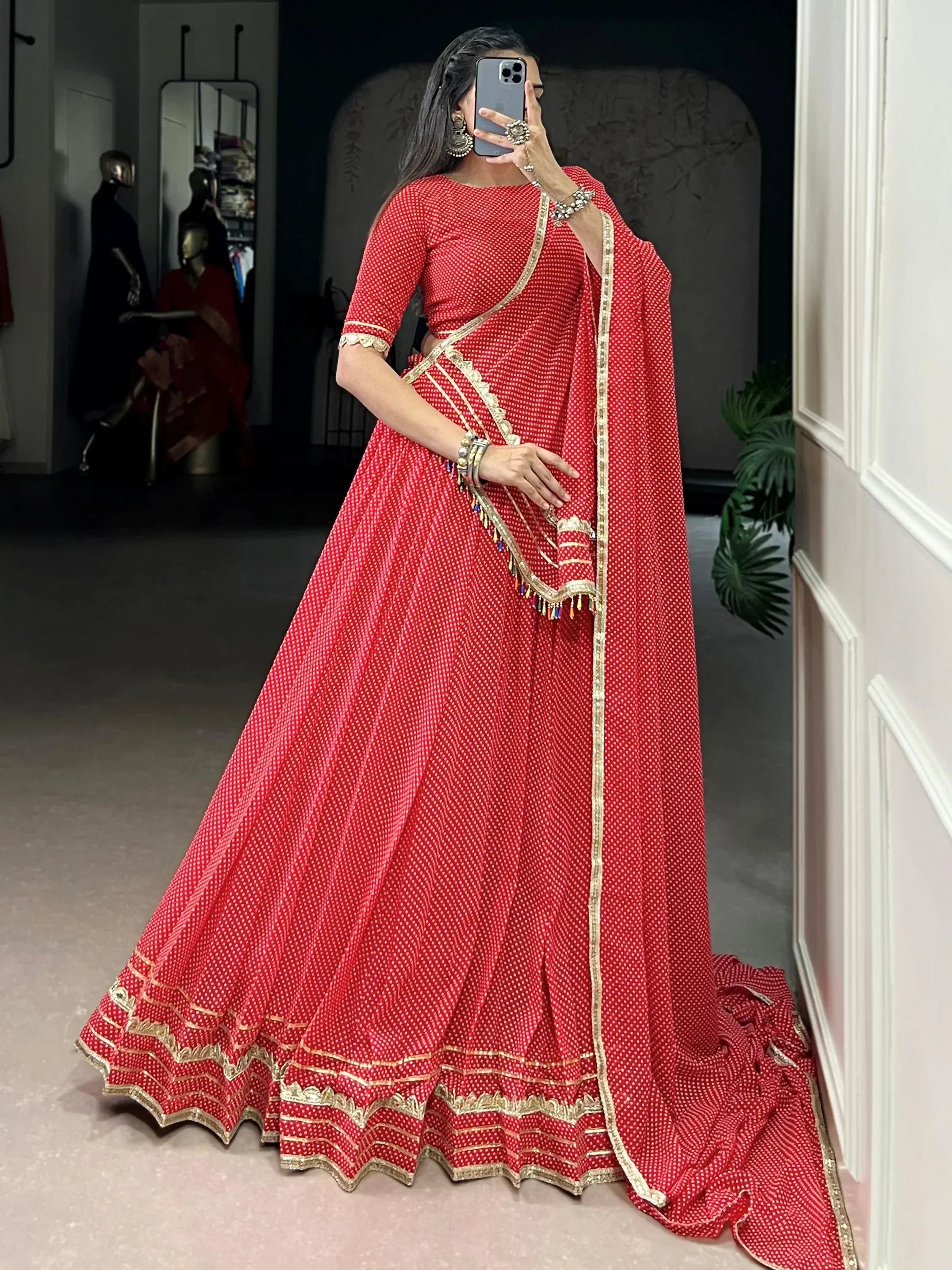 Red printed lehenga choli with gold border, ethnic Indian wear for weddings and festivals