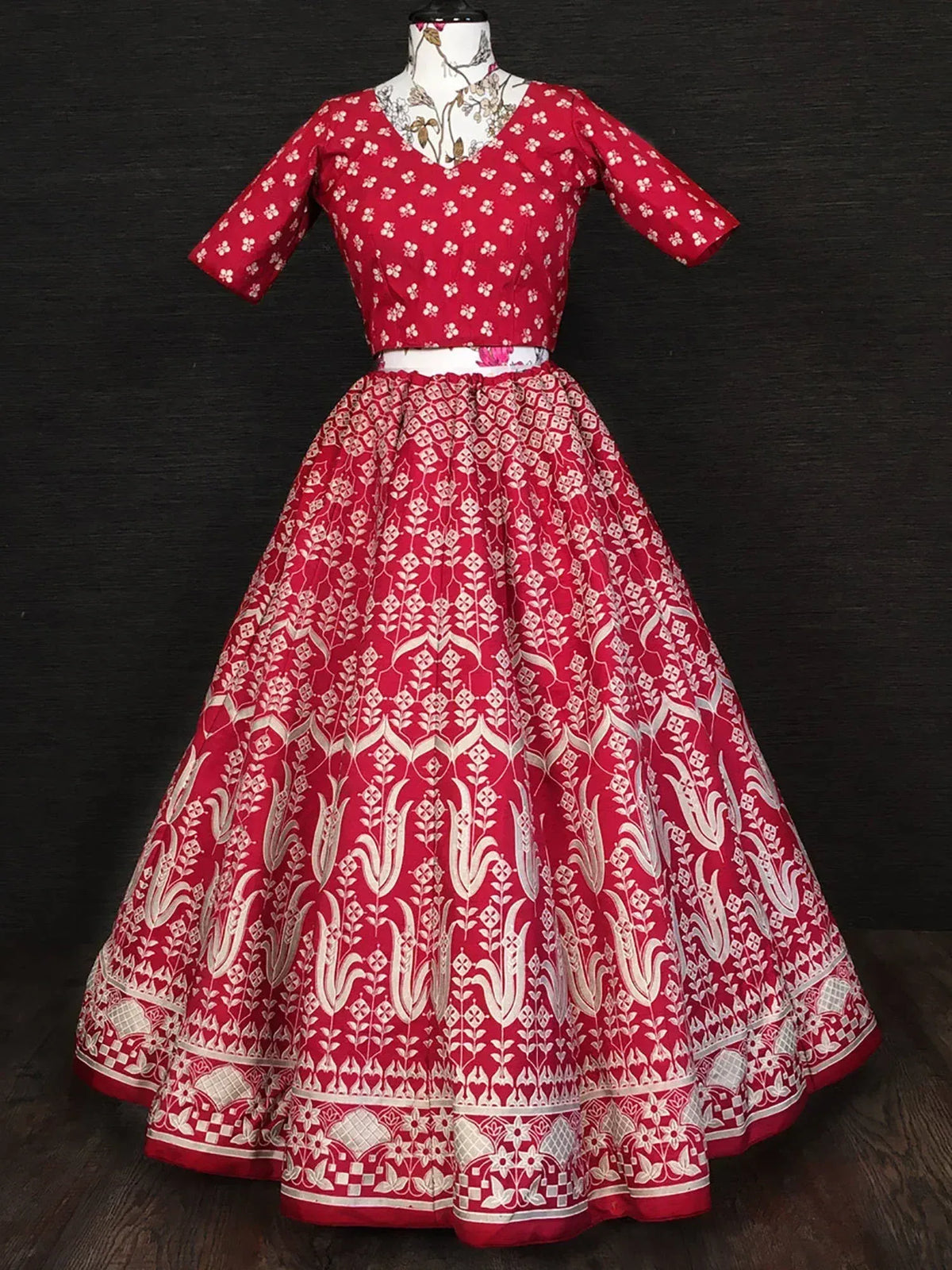 Red and white printed lehenga choli with floral motifs, perfect for Indian ethnic wear occasions