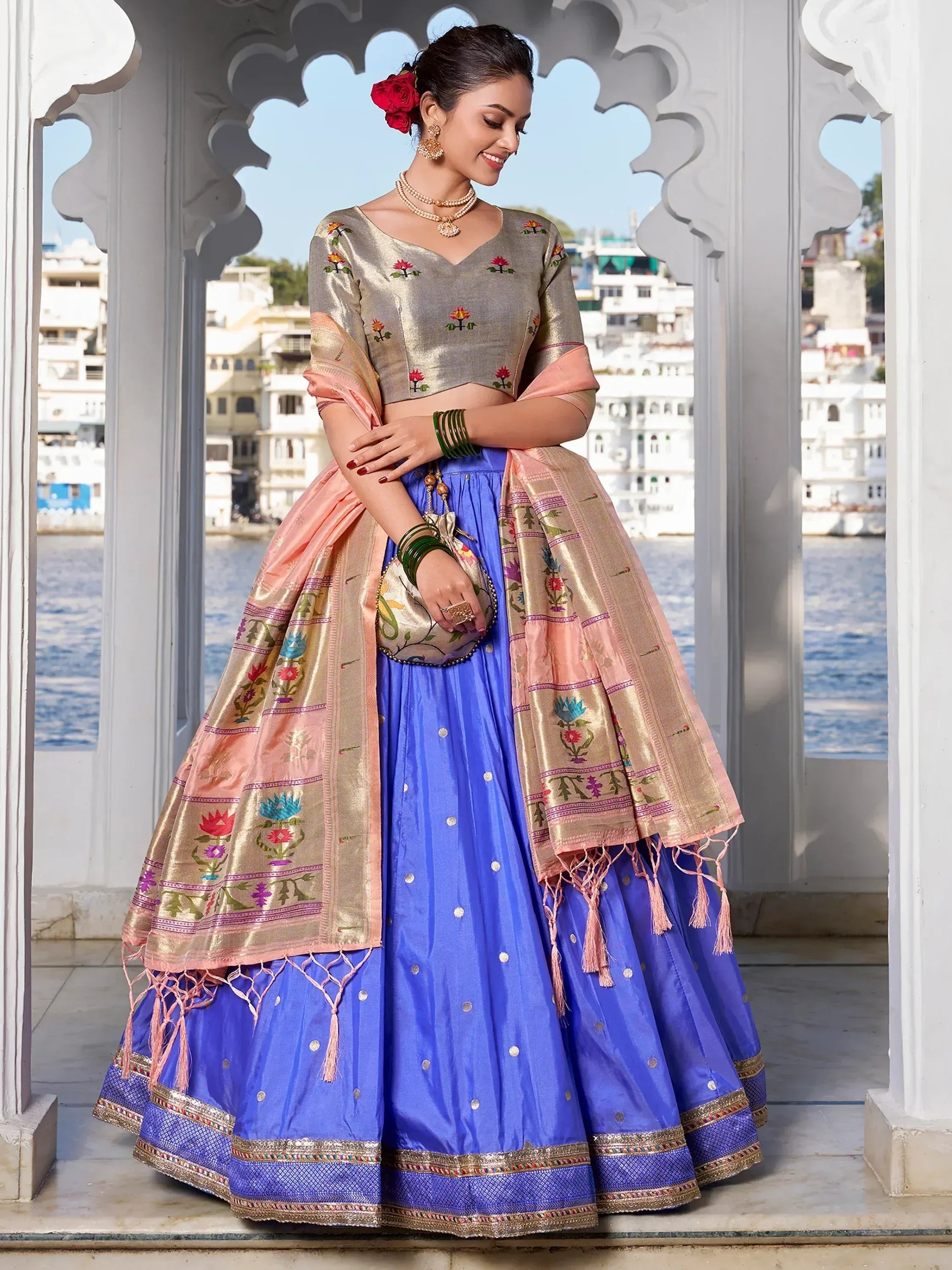 Blue lehenga choli with floral embroidery and pink dupatta, perfect for Indian ethnic wear