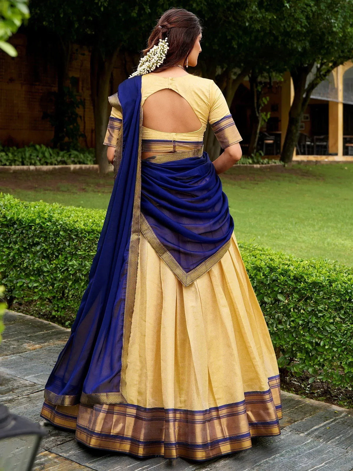 Blue and gold designer lehenga choli with backless blouse, perfect for Indian ethnic wear occasions