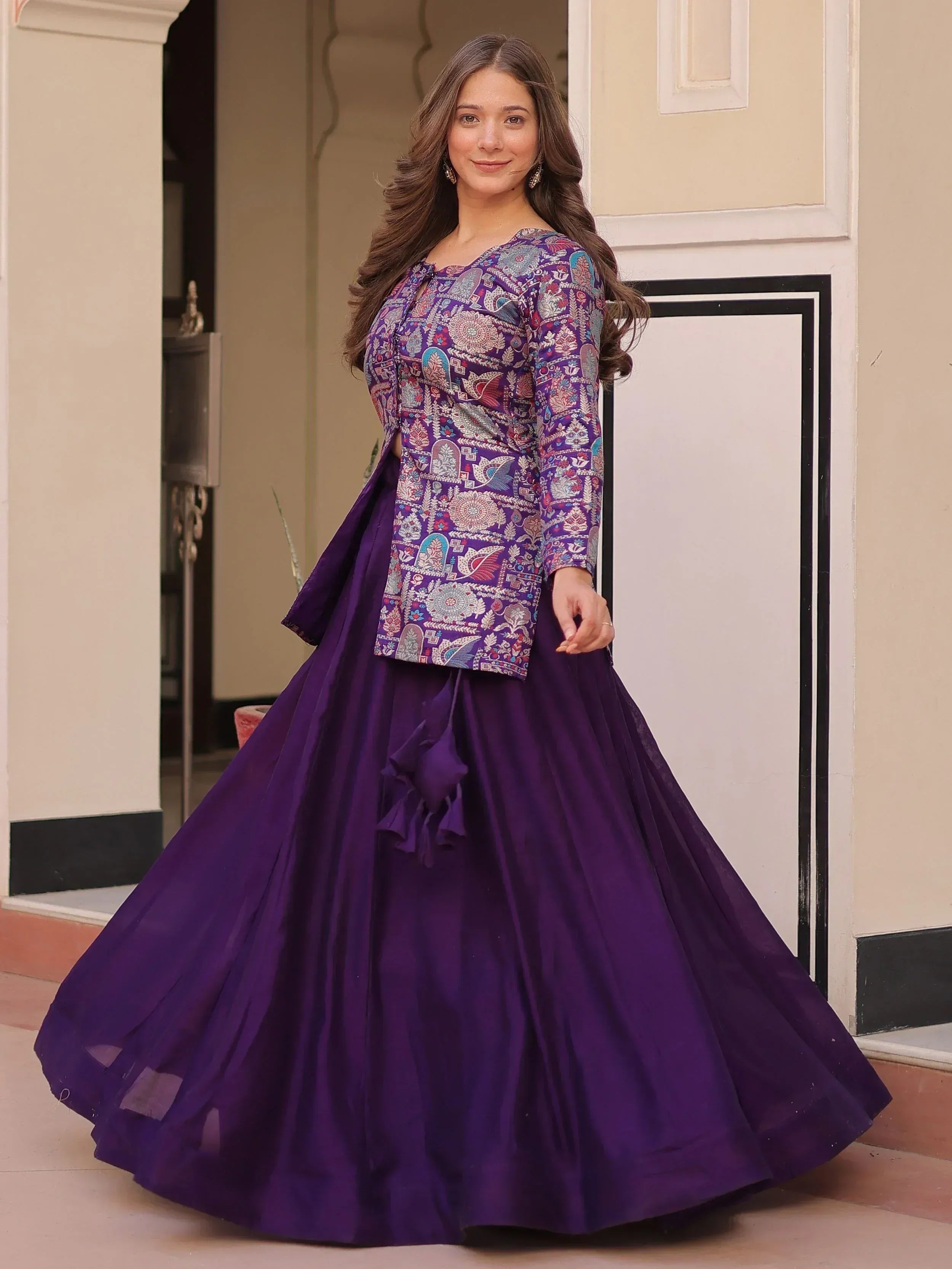 Purple ethnic gown with printed blouse and flared skirt, perfect for Indian occasions
