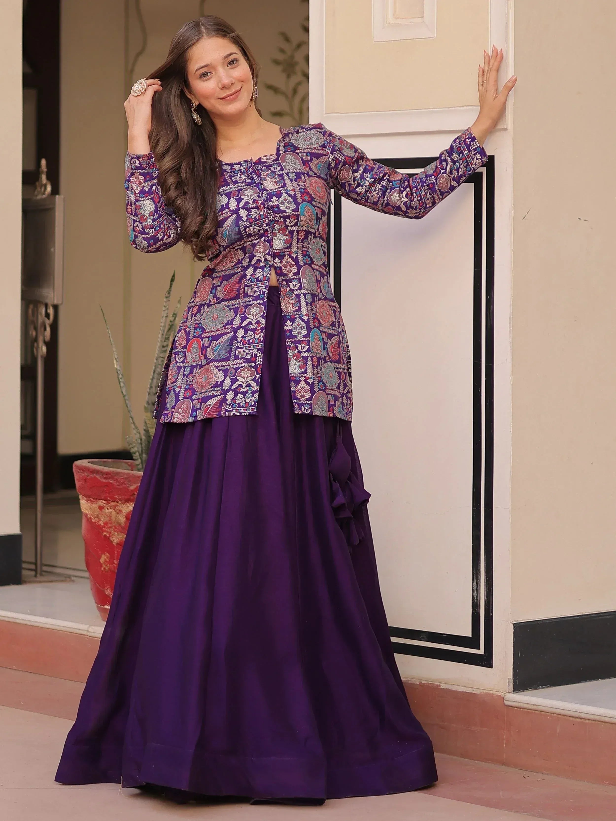 Purple printed ethnic gown with flared skirt, perfect for Indian occasions and festive wear