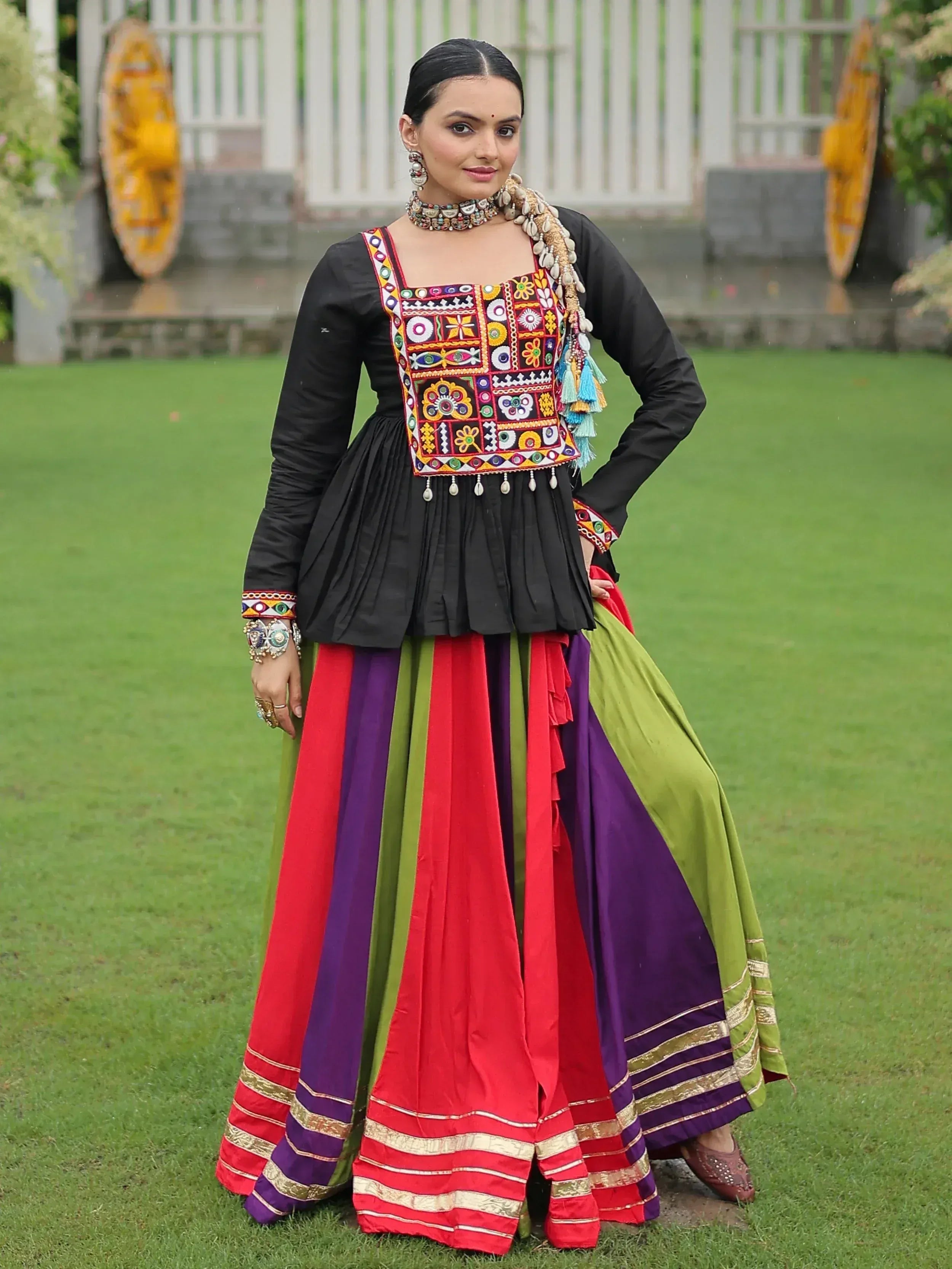 Colorful embroidered ethnic lehenga choli with black blouse and vibrant skirt