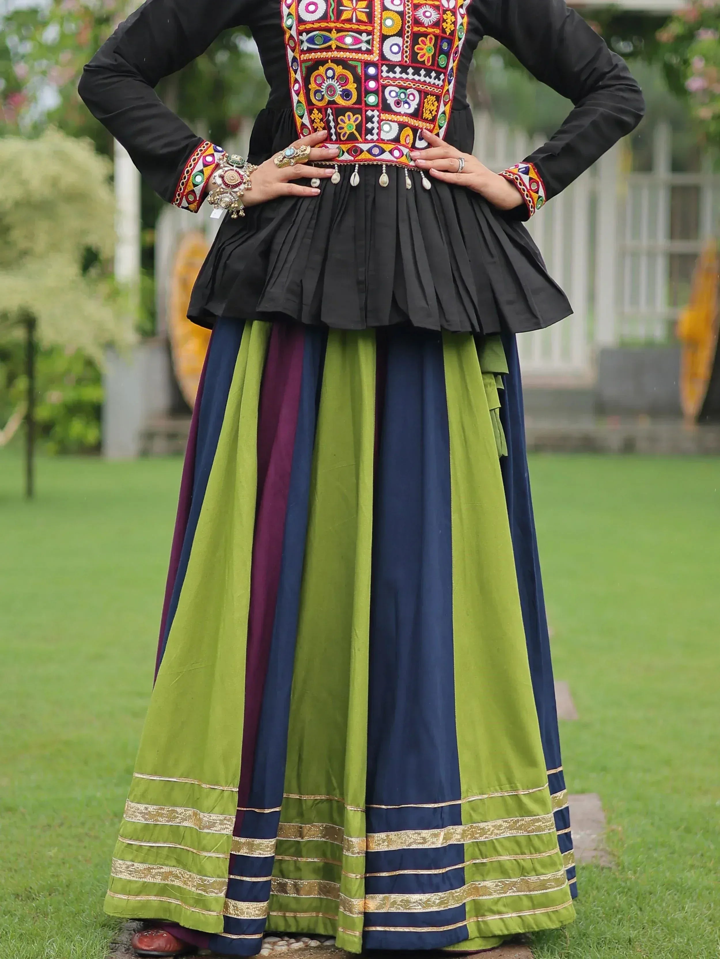 Black embroidered top with colorful mirror work and green-blue striped skirt, Indian ethnic wear
