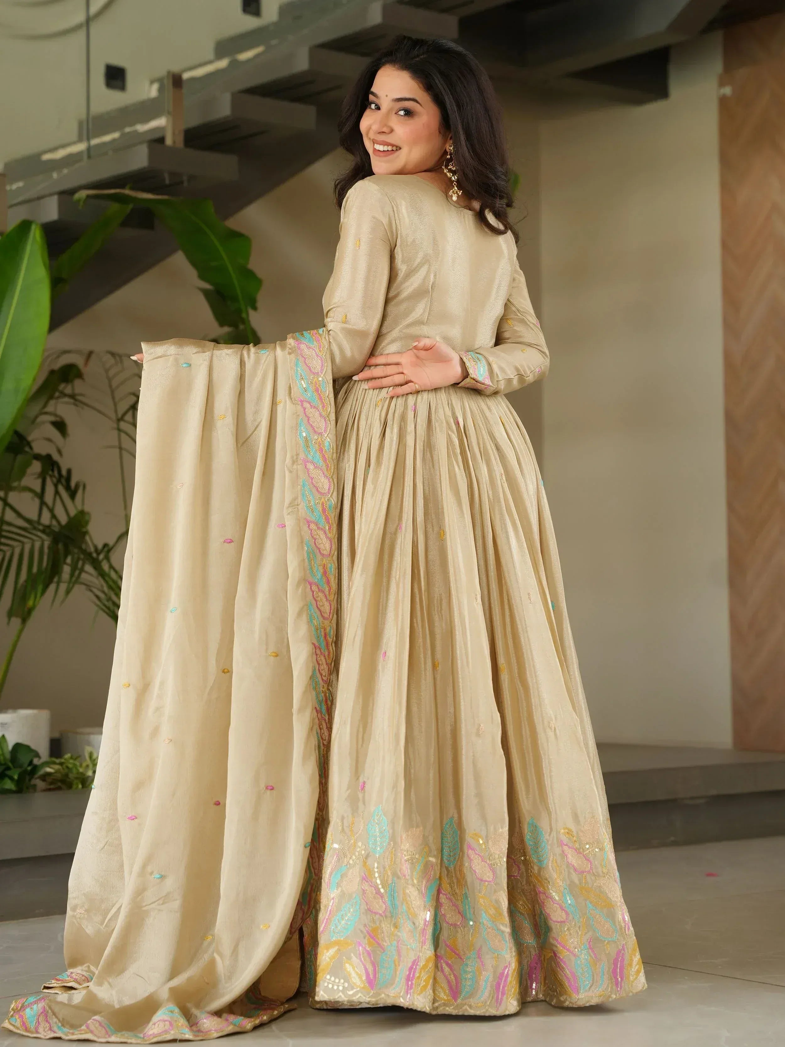 Beige embroidered anarkali suit with colorful floral detailing, perfect for Indian ethnic wear occasions