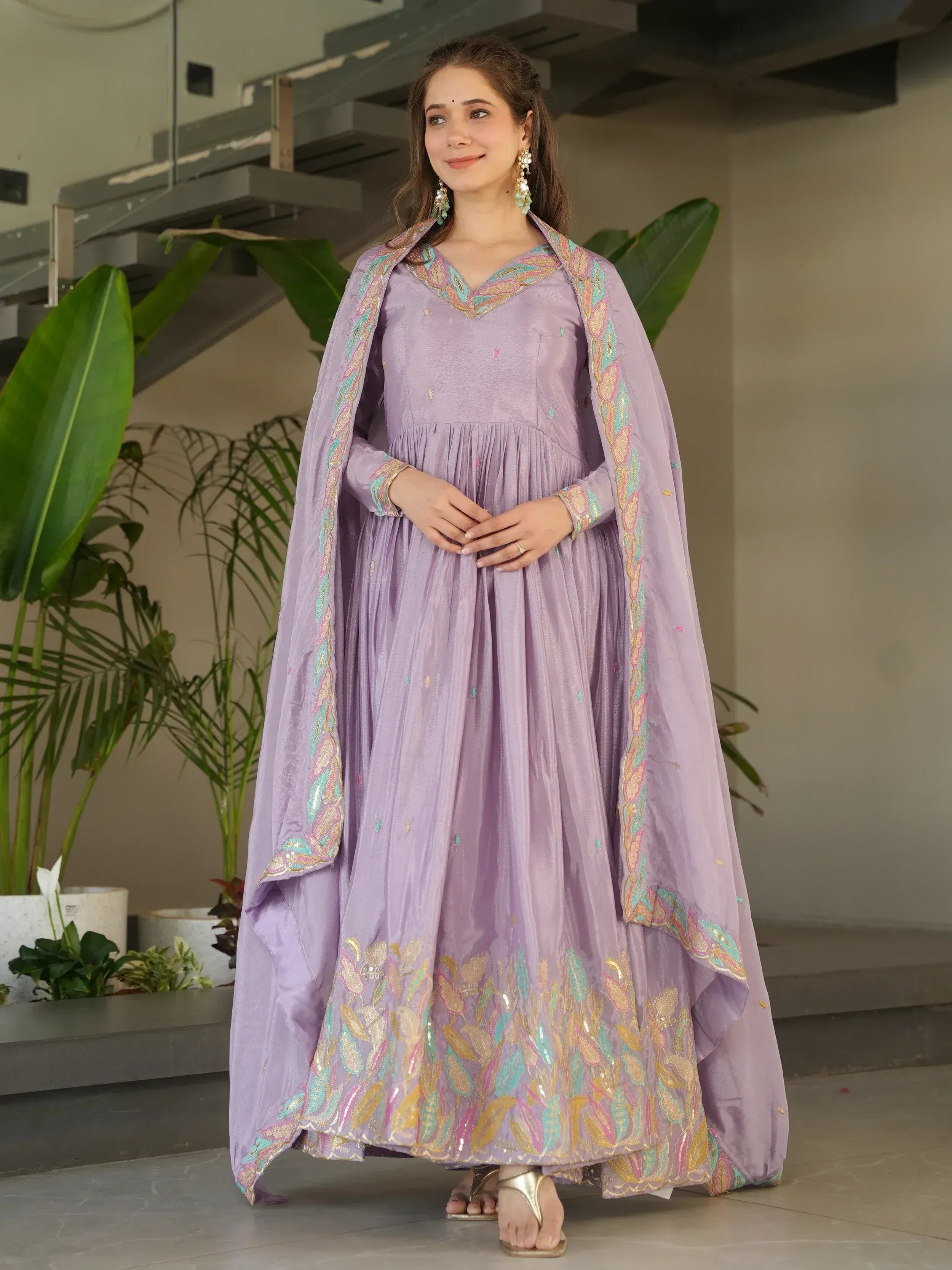 Lavender ethnic gown with embroidered cape, perfect for Indian celebrations and festive occasions.