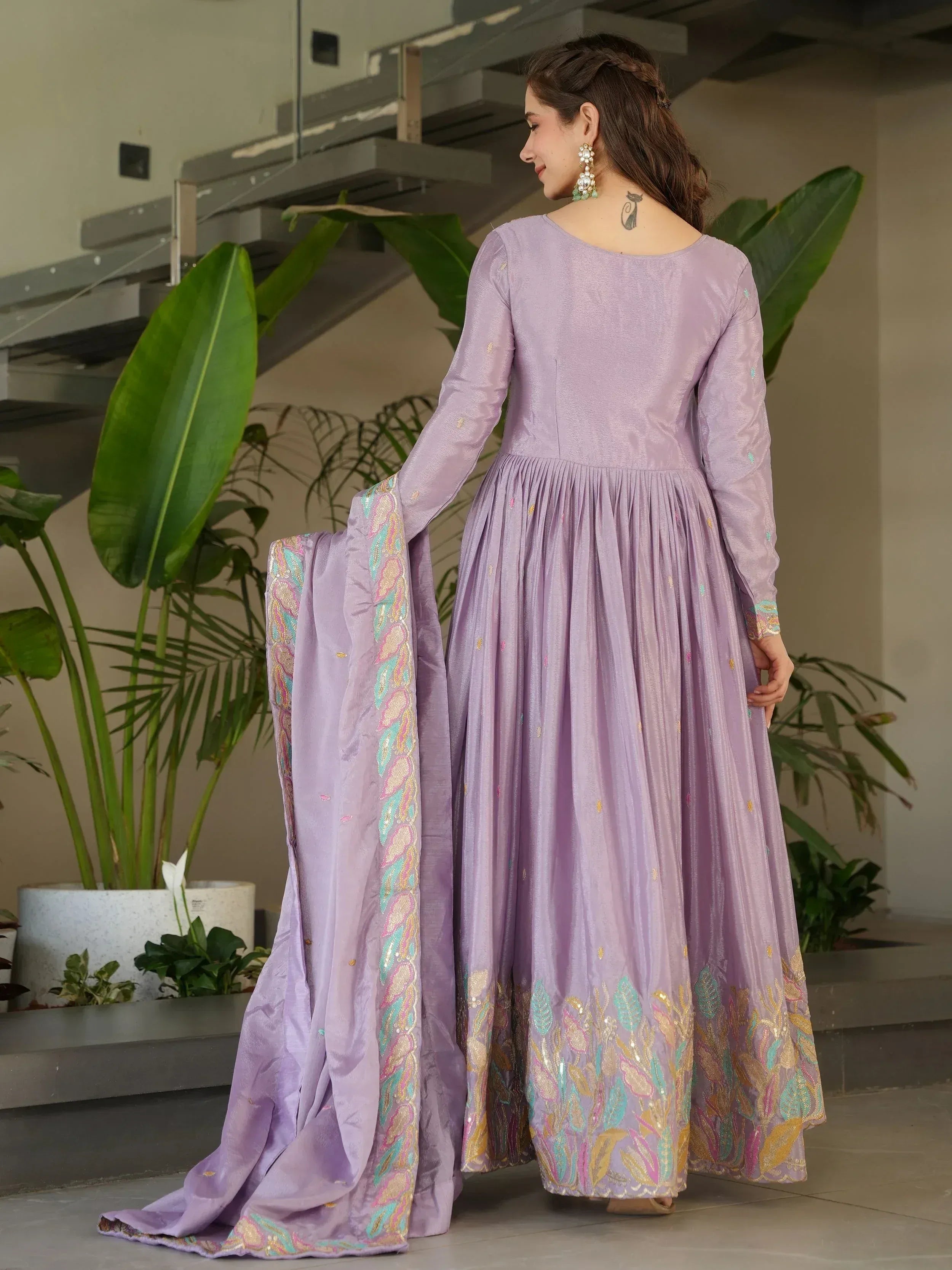 Lavender ethnic gown with floral embroidery and matching dupatta, perfect for Indian festive occasions.
