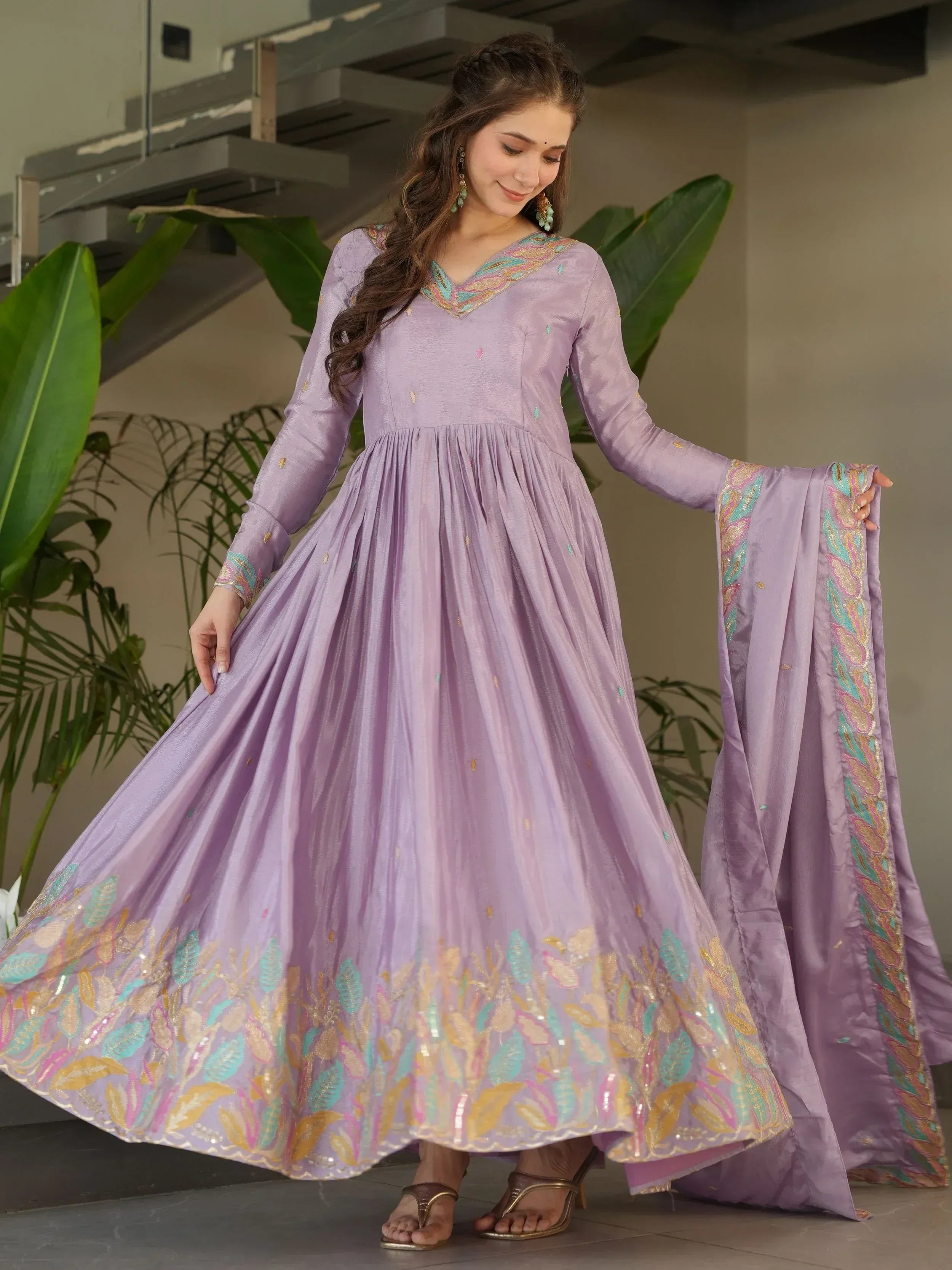Lavender ethnic gown with floral embroidery, perfect for Indian festive occasions and weddings.