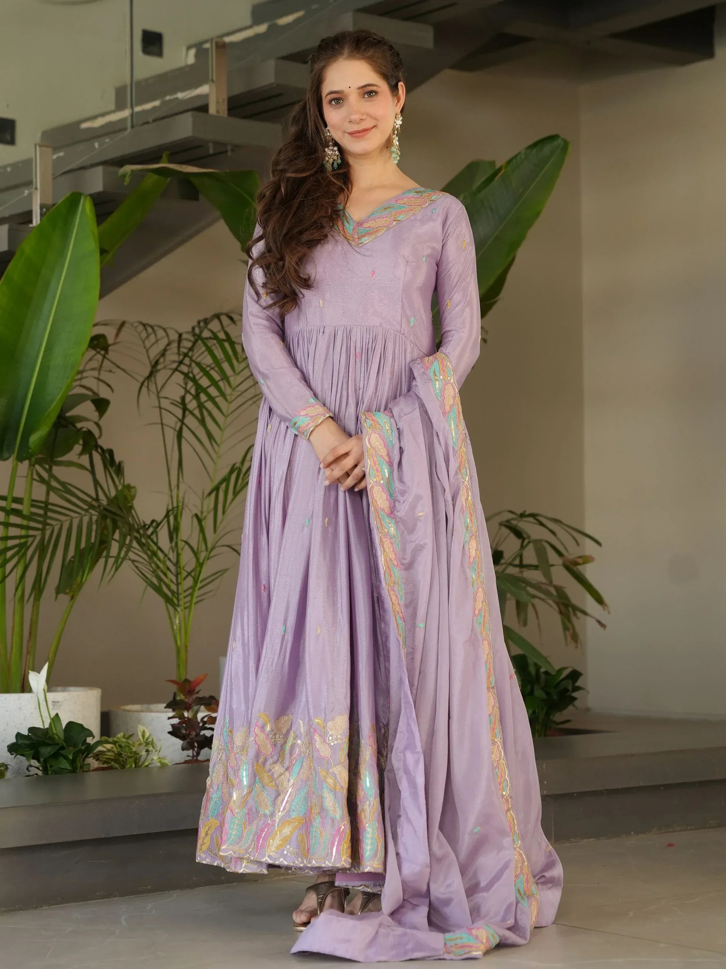 Lavender ethnic gown with colorful embroidery, perfect for Indian festive occasions and weddings