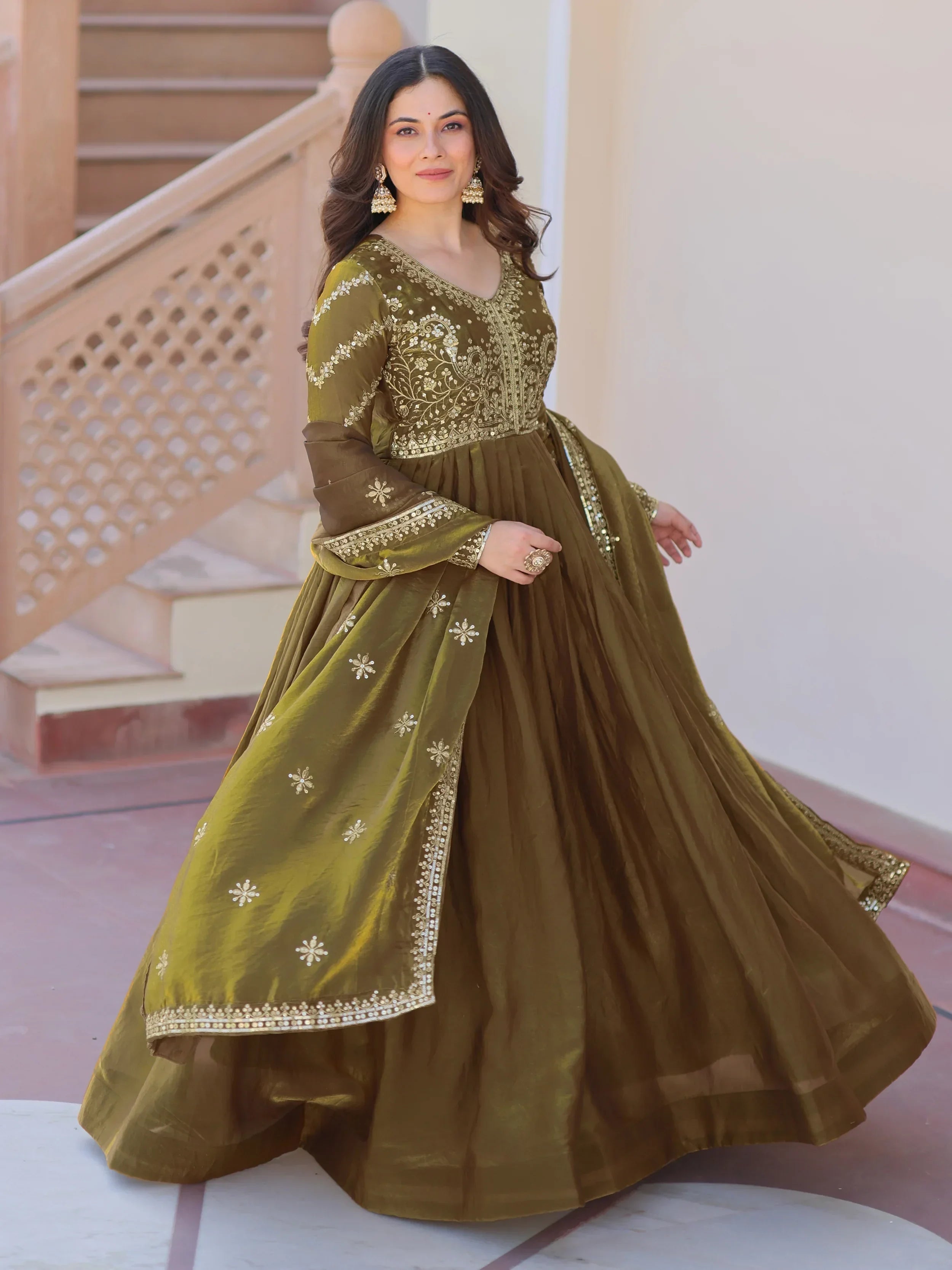 Woman in olive green embroidered ethnic gown with dupatta, traditional Indian attire