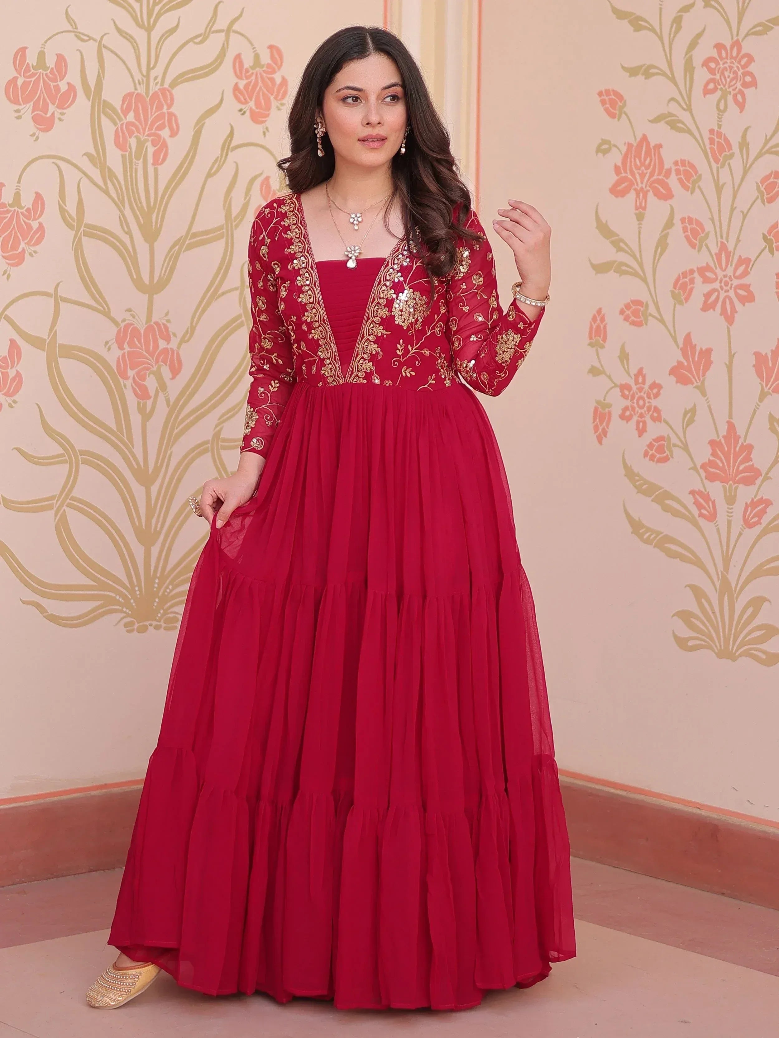 Red embroidered ethnic gown with gold detailing, perfect for Indian festive occasions