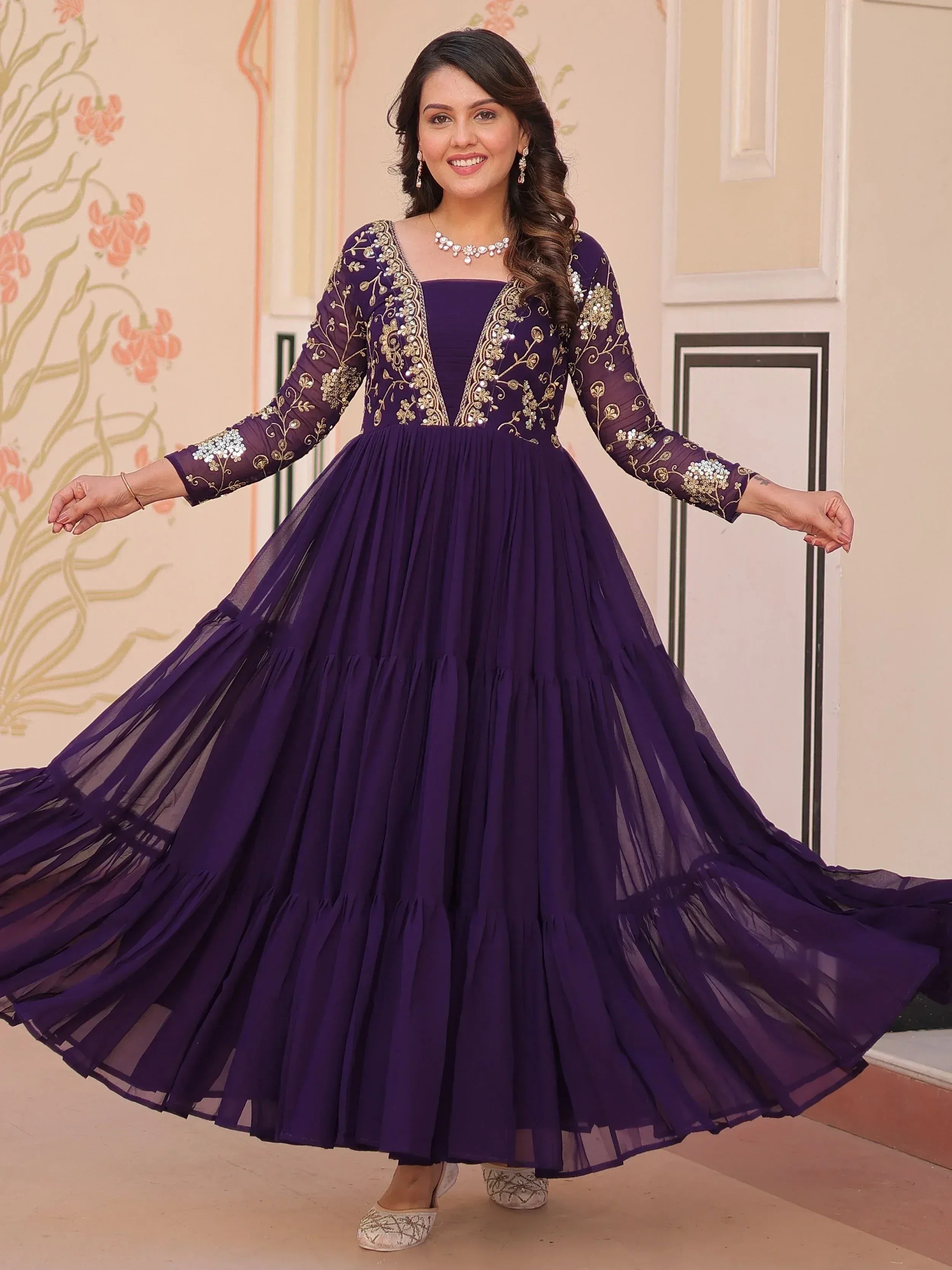 Purple ethnic gown with gold embroidery, perfect for Indian occasions and festive wear.