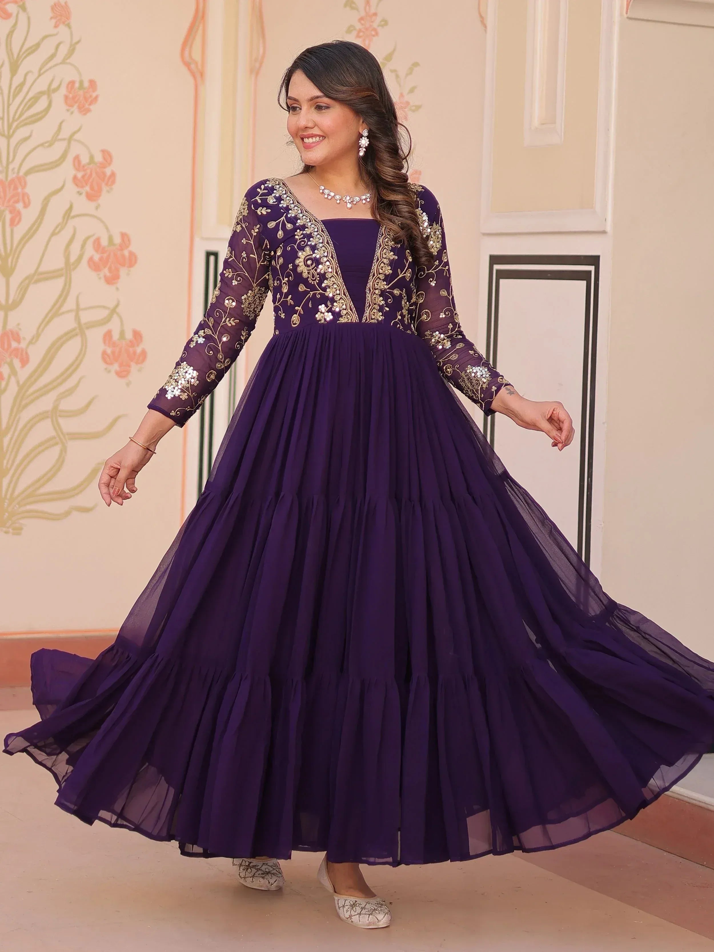 Purple ethnic gown with gold embroidery, perfect for Indian festive occasions and weddings.