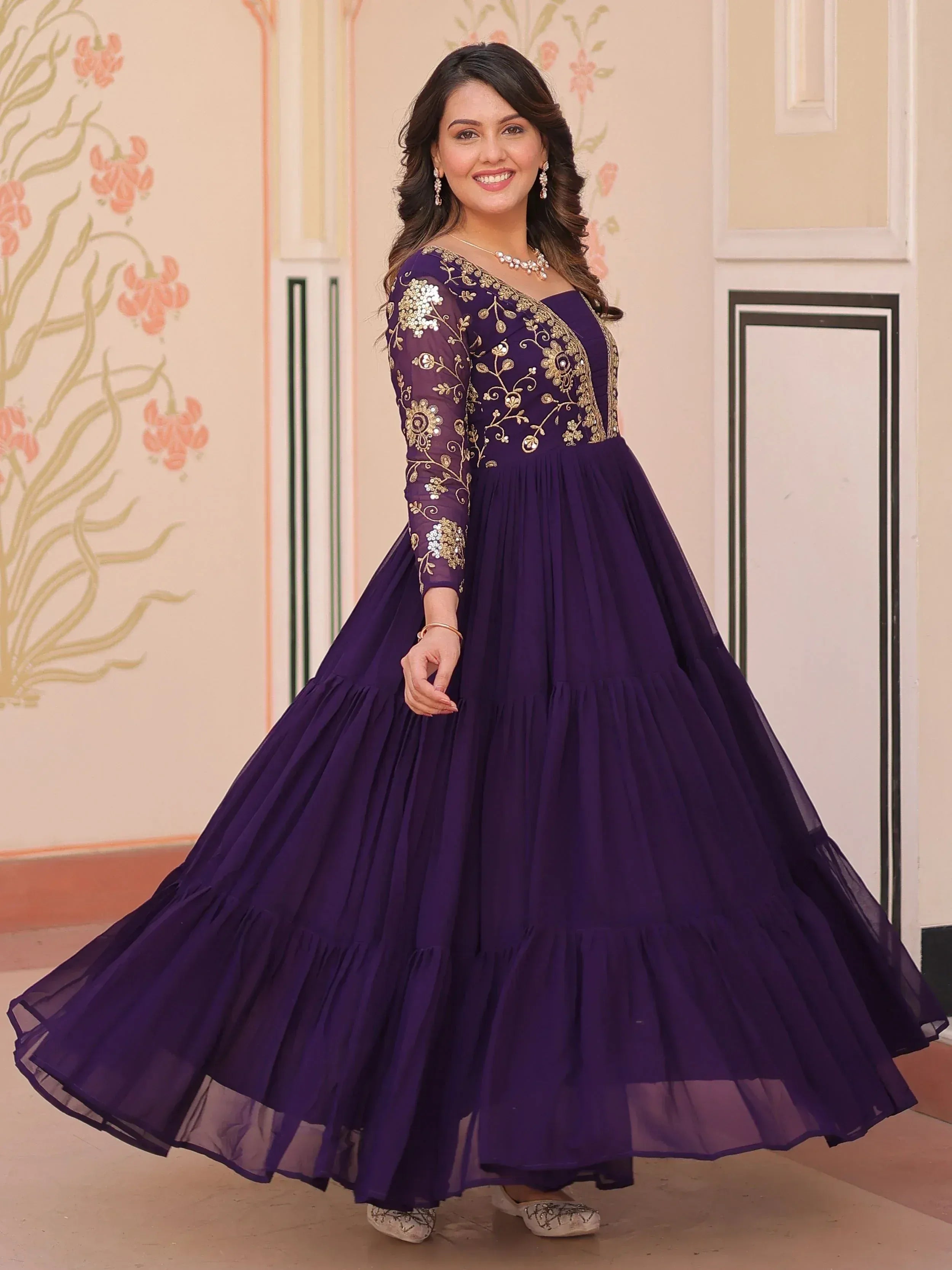 Purple ethnic gown with gold embroidery, perfect for Indian weddings and festive occasions