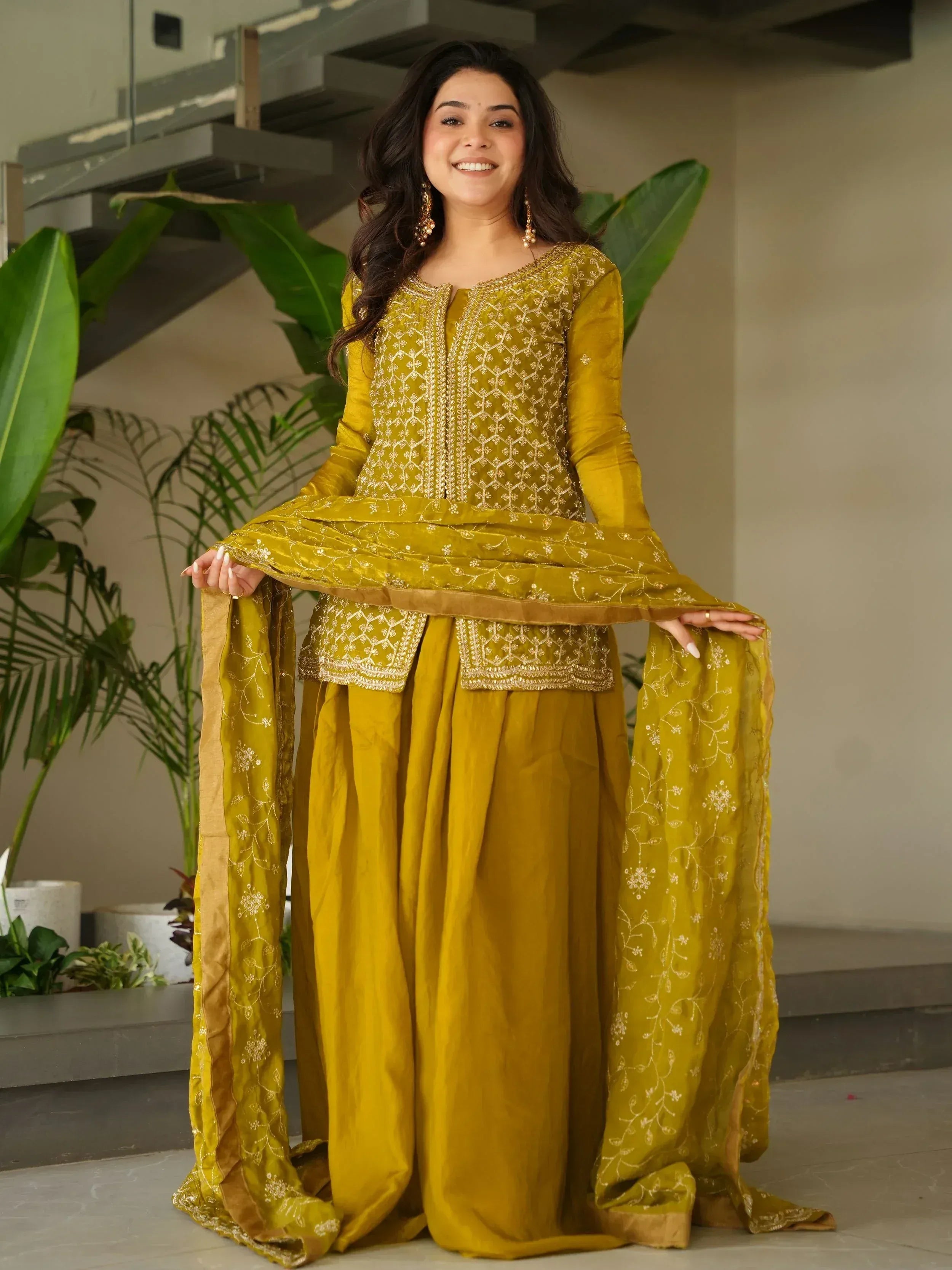 Mustard yellow embroidered salwar kameez with flared sleeves and dupatta, perfect for ethnic occasions