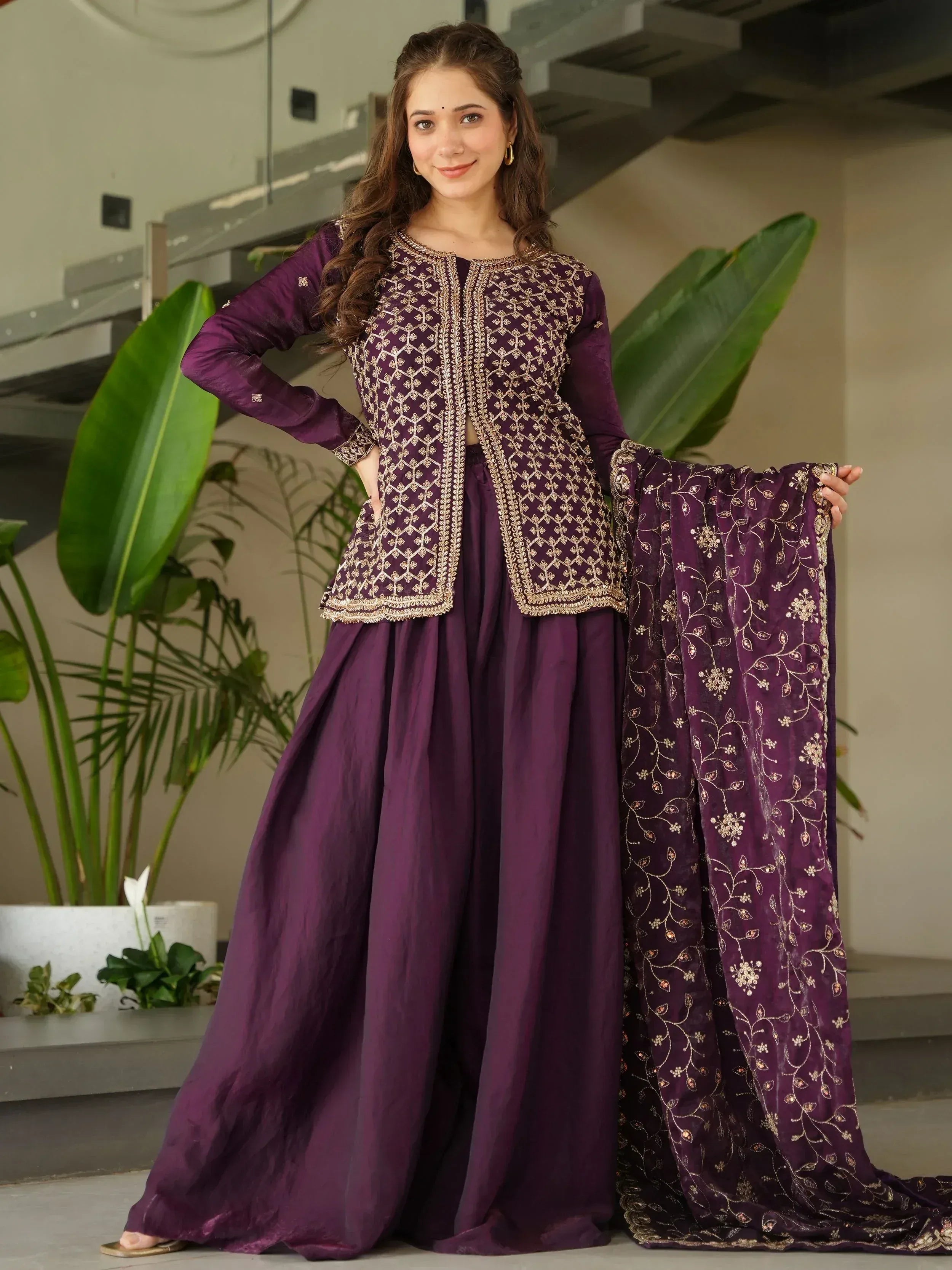 Purple embroidered ethnic sharara suit with gold detailing, perfect for Indian festive occasions