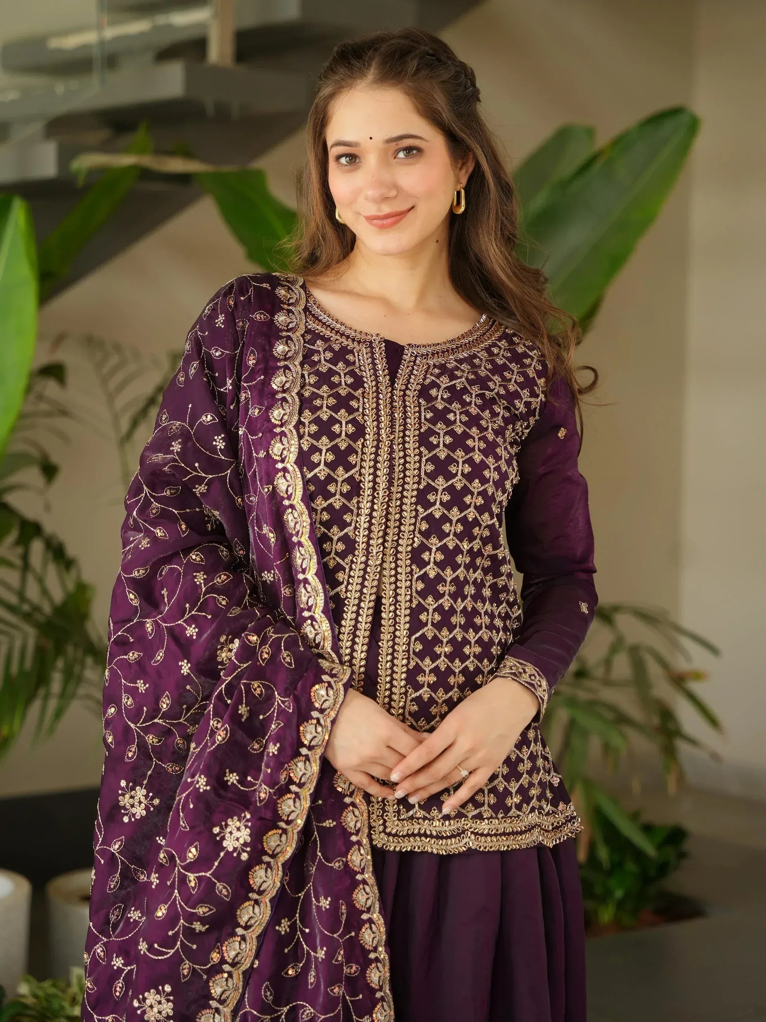 Purple embroidered ethnic salwar kameez with gold detailing, perfect for Indian festive occasions