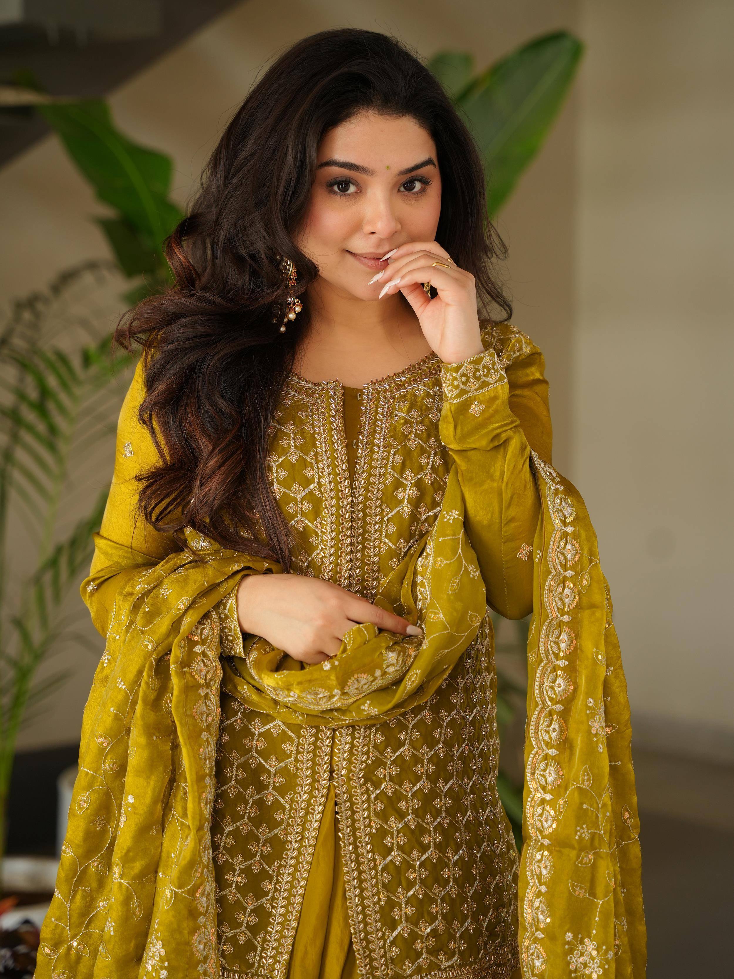 Mustard velvet ethnic suit with gold embroidery, perfect for festive occasions and traditional events.