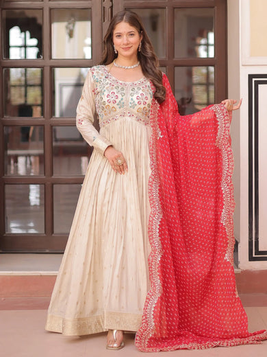 Charming Cream Silk Pearl Work Gown With Bandhani Dupatta