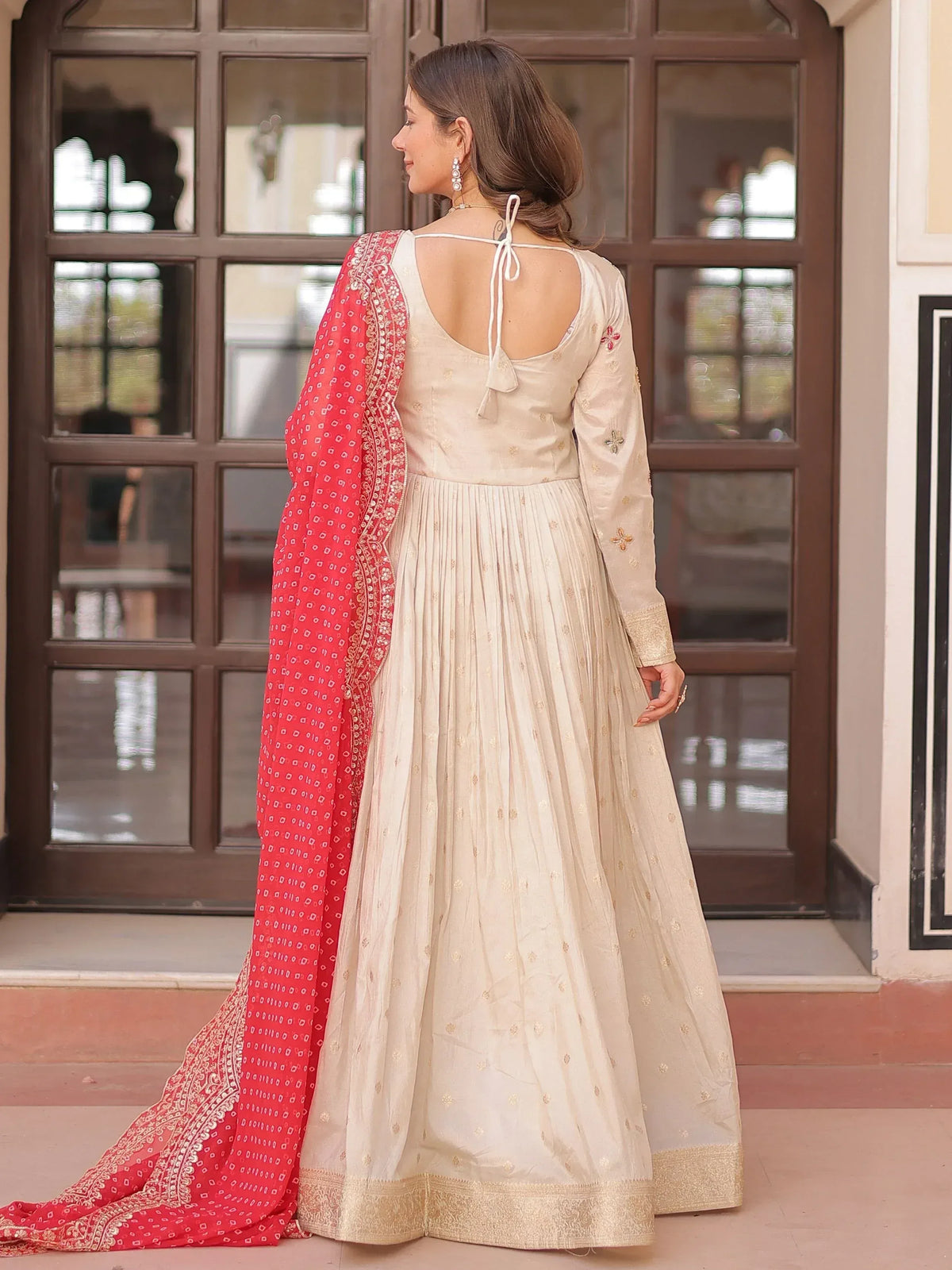 Cream embroidered anarkali with red dupatta, back view, Indian ethnic wear