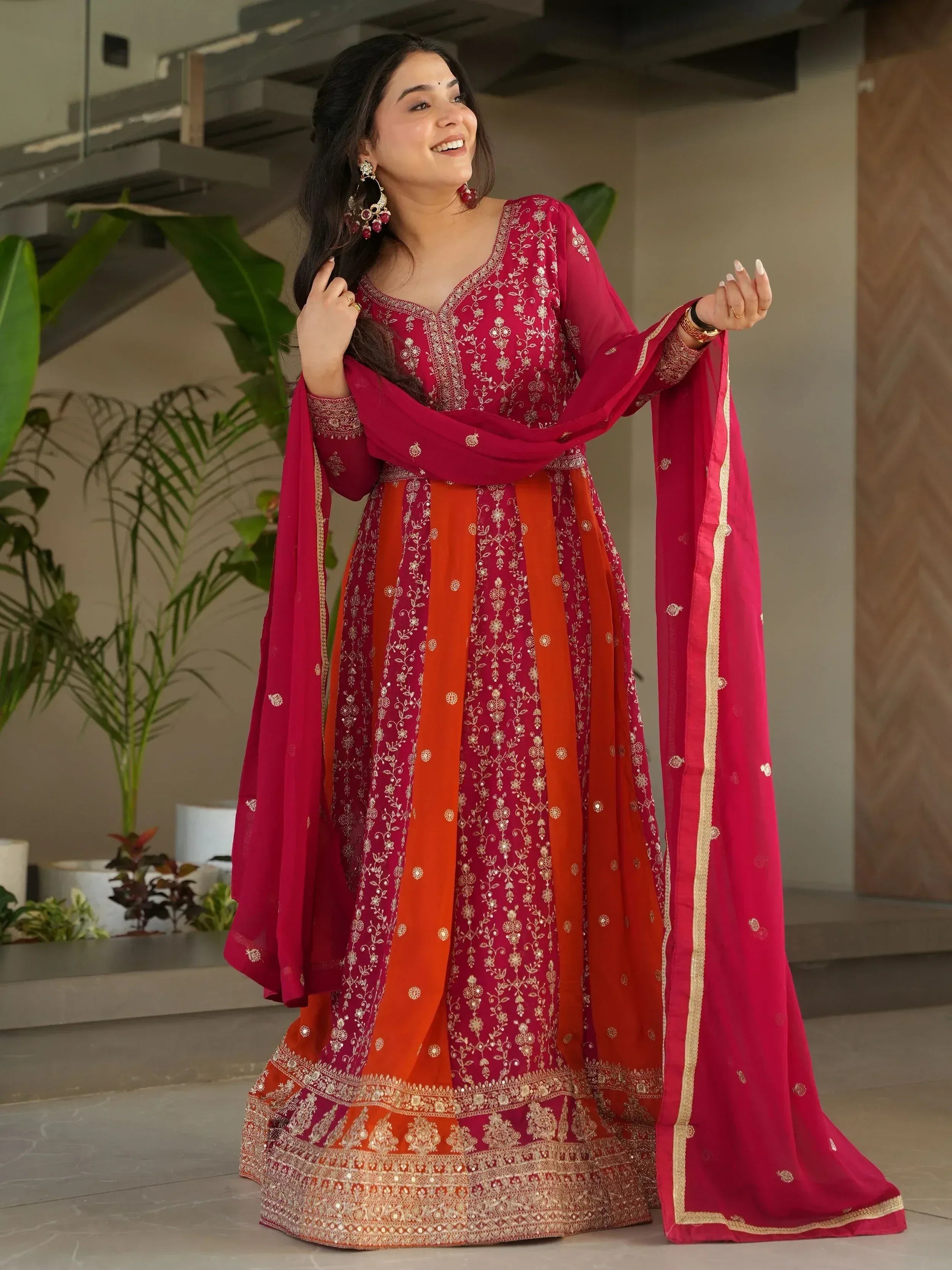 Red and orange embroidered anarkali suit with gold detailing, perfect for Indian ethnic occasions